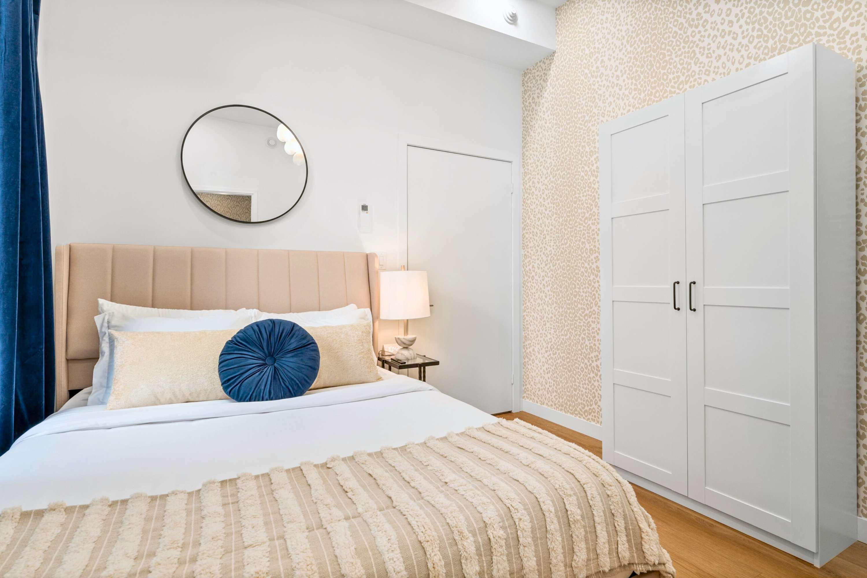 Relaxing bedroom with plush queen bed and built in wardrobe.