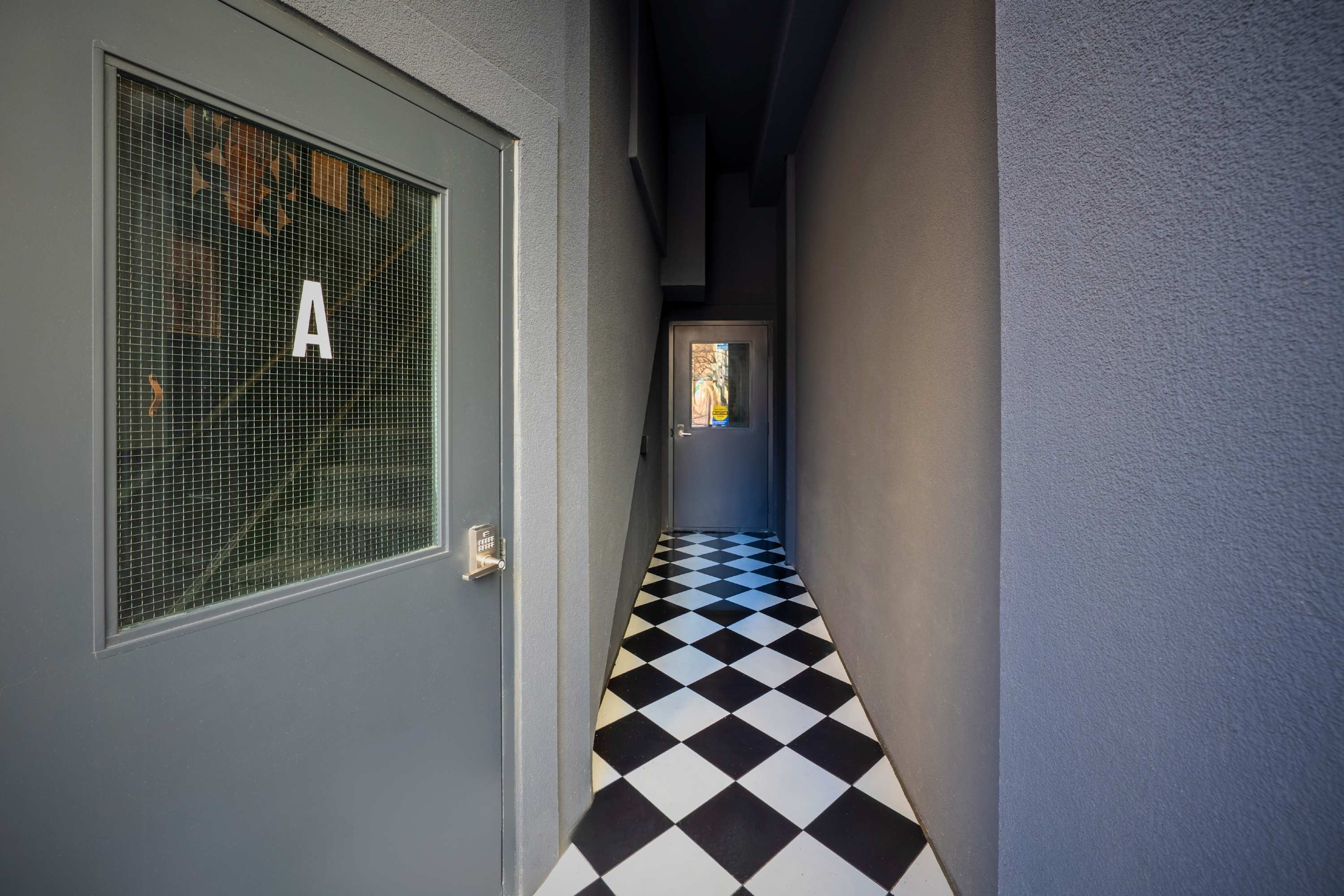 Functional building exterior with visible entryway.