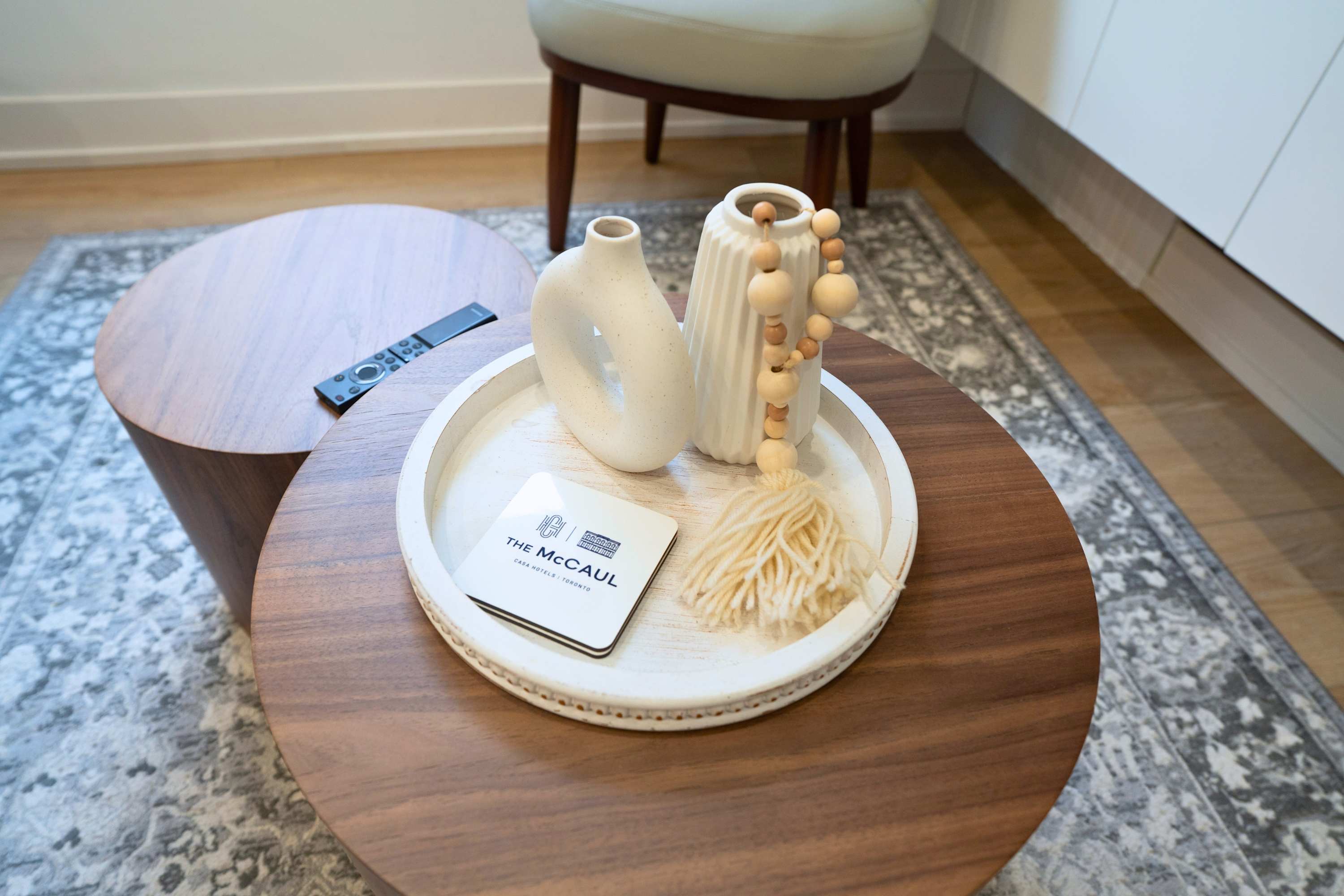 Modern round accent table with stylish details.