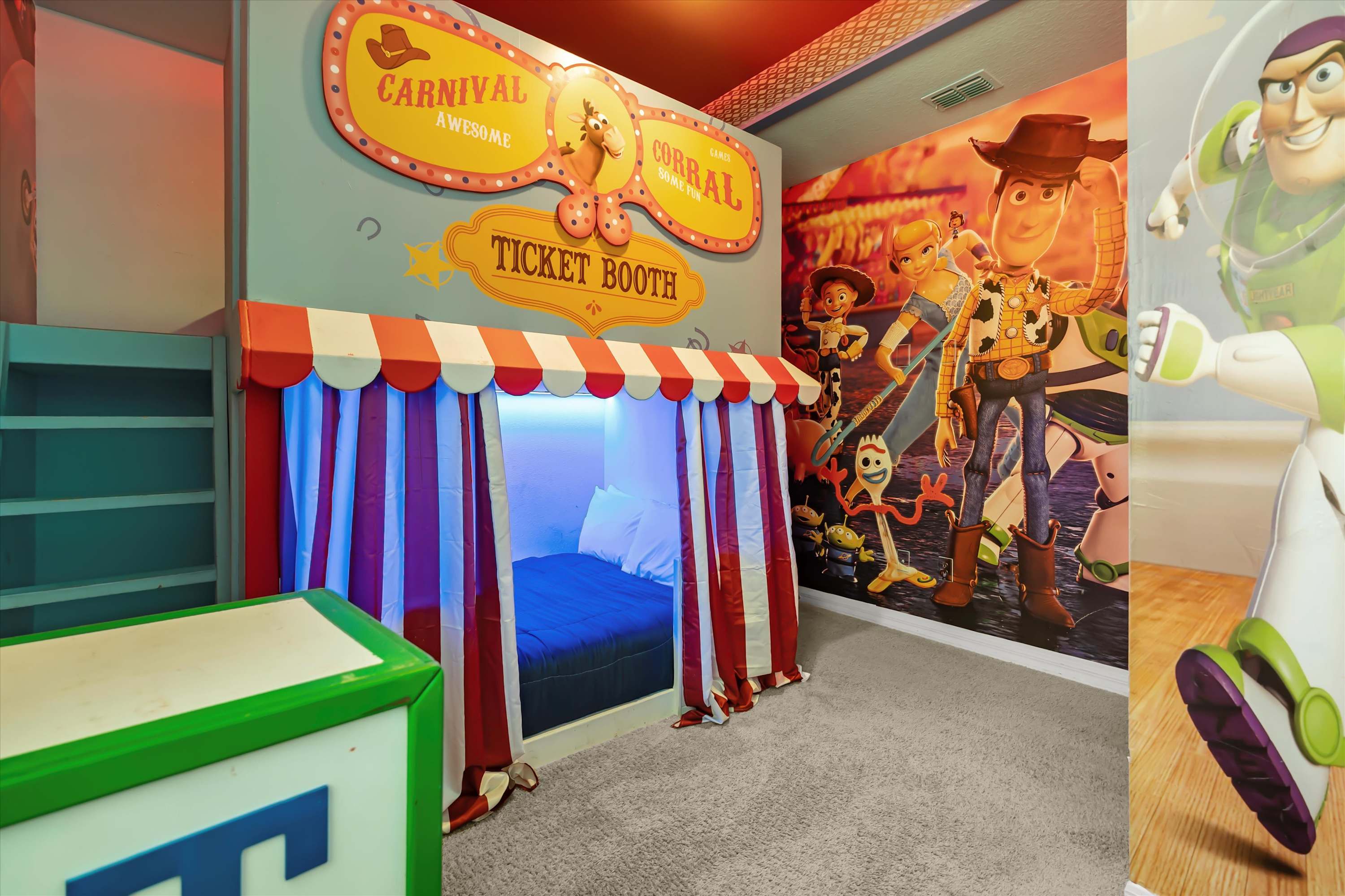 Toy Story-themed bedroom with upper bunk bed for extra kids’ sleeping space and fun.