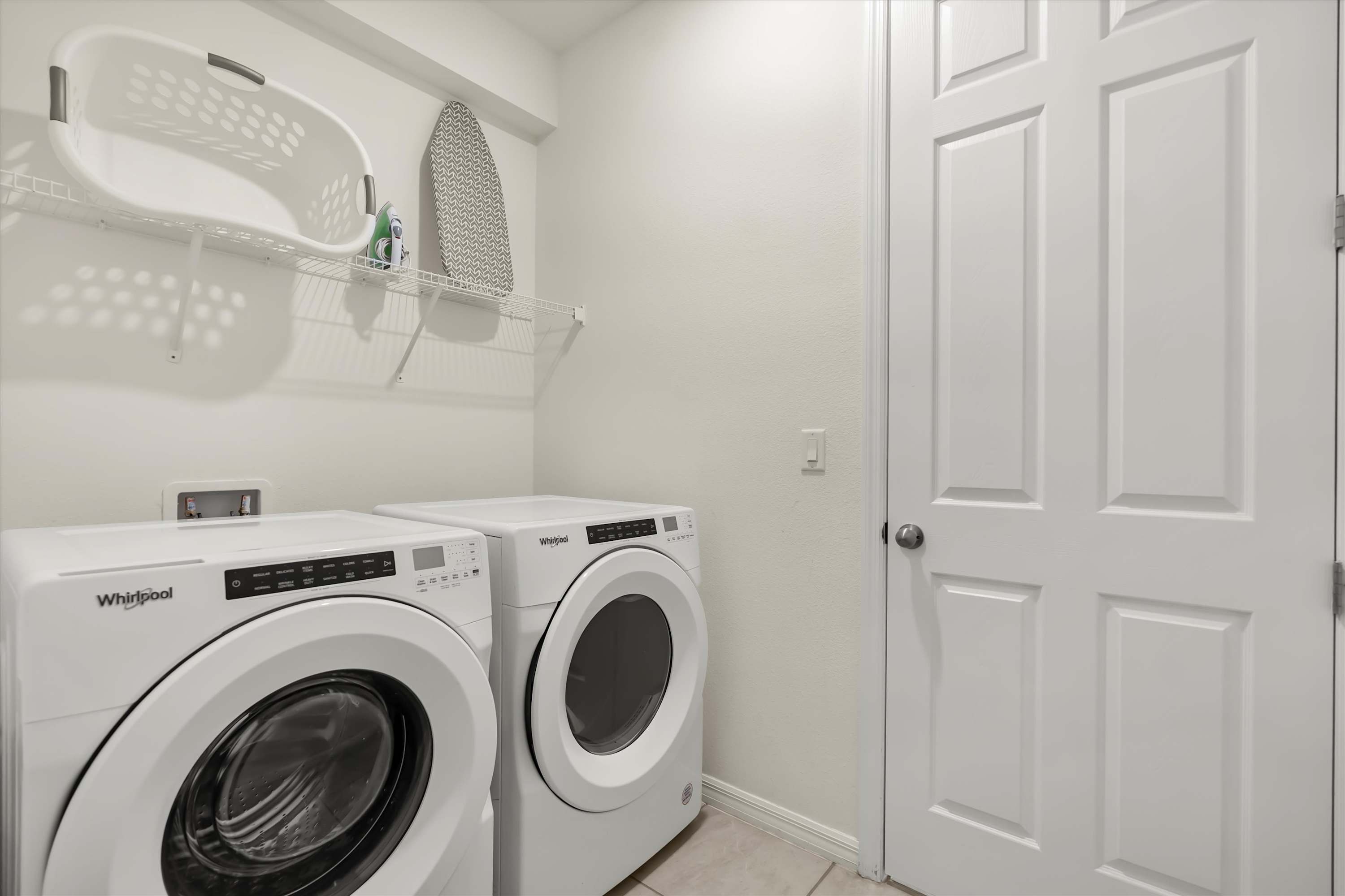 Laundry room with washer and dryer for hassle-free stays.