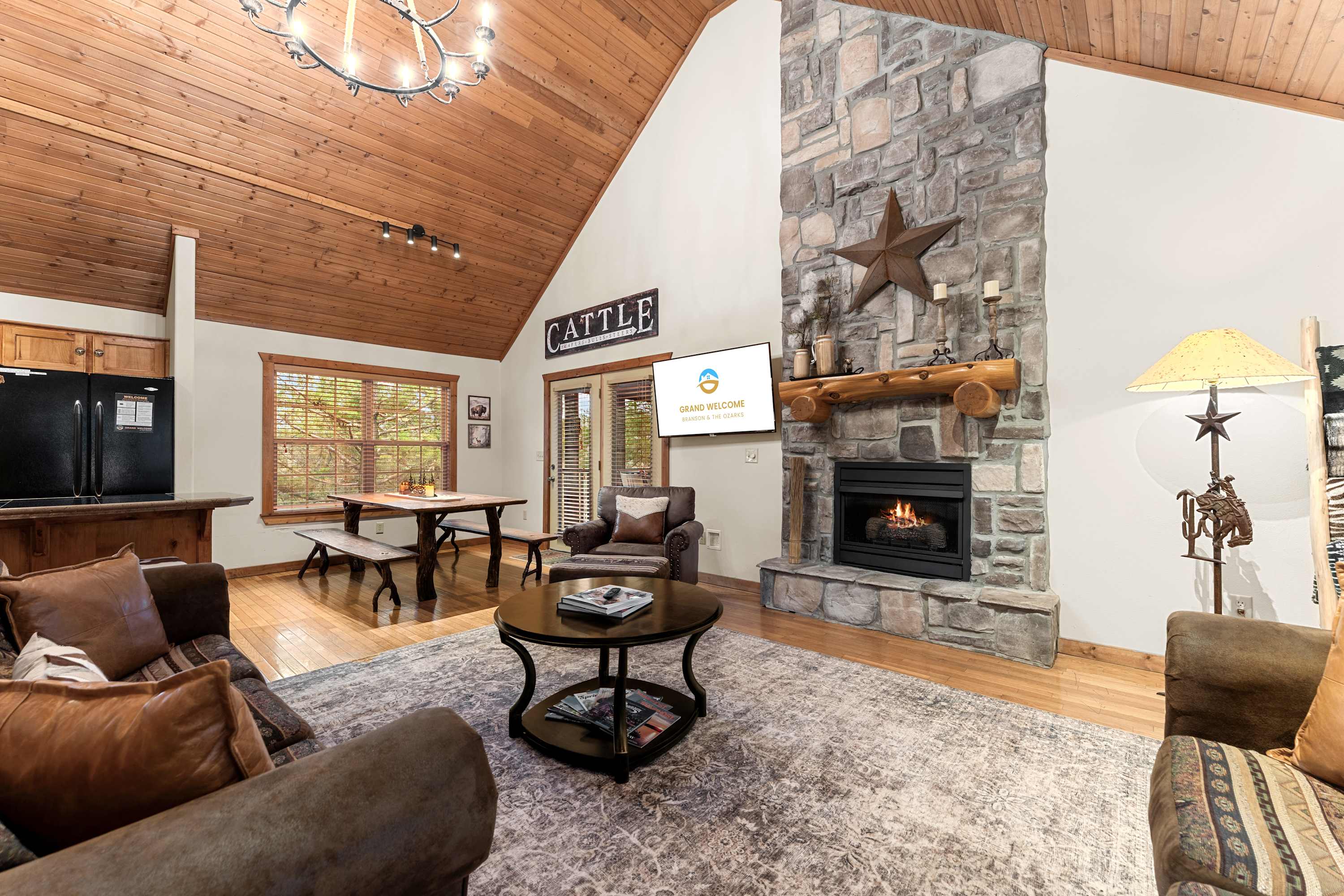 Spacious open living space with Smart TV, fireplace, and sofa sleeper