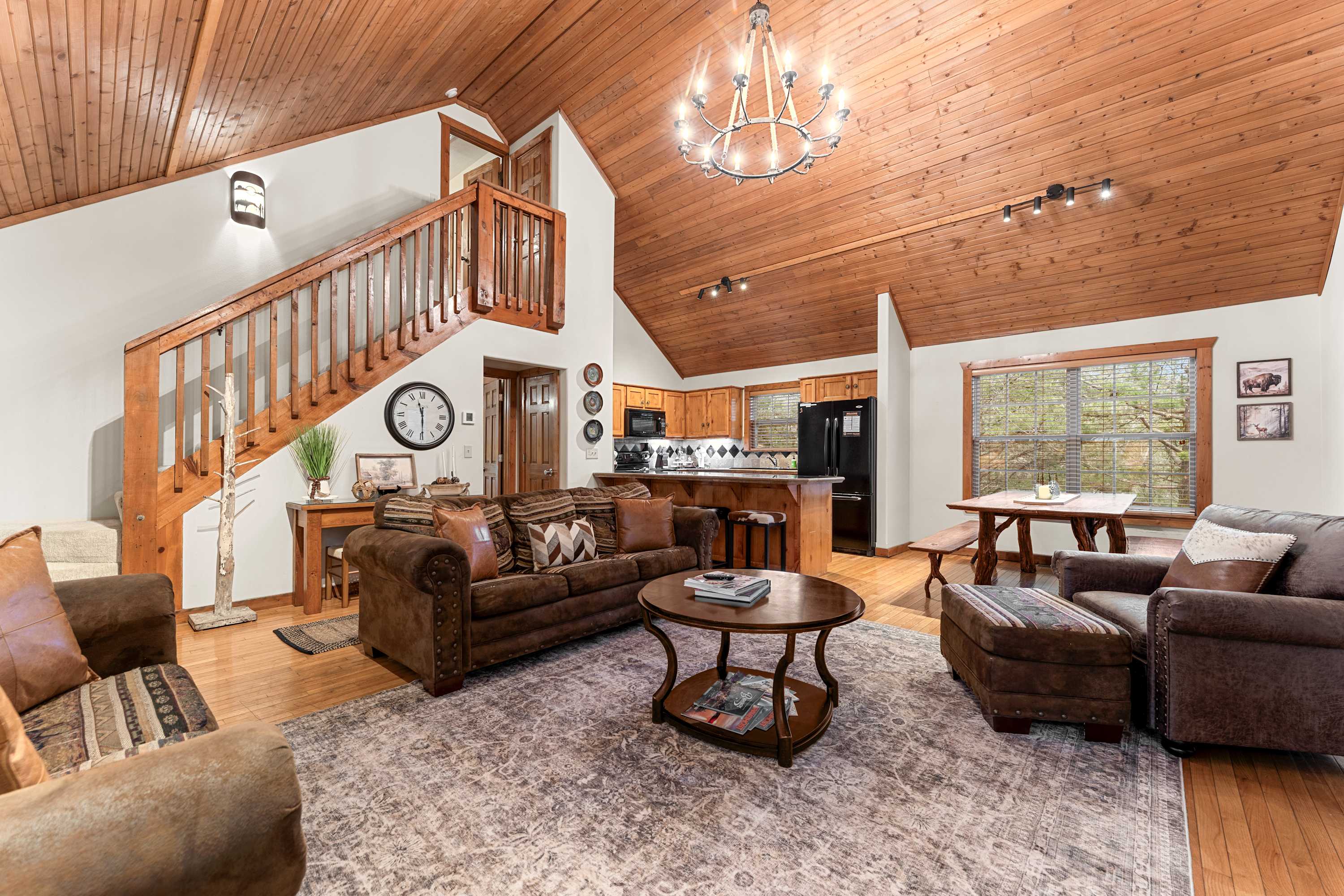 Spacious open living space with Smart TV, fireplace, and sofa sleeper