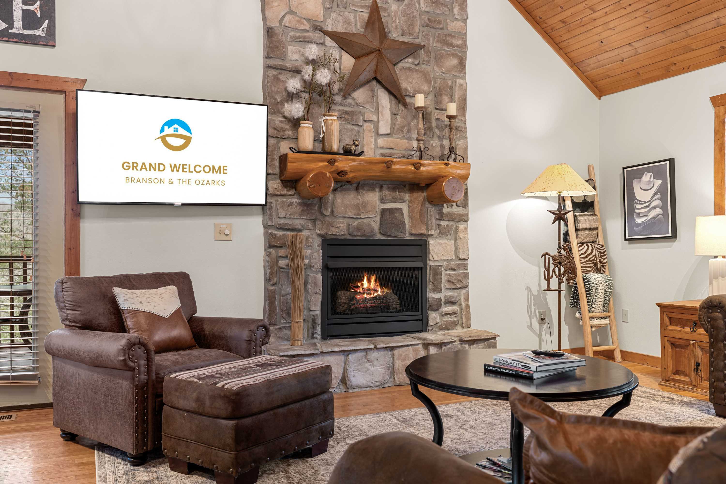 Spacious open living space with Smart TV, fireplace, and sofa sleeper