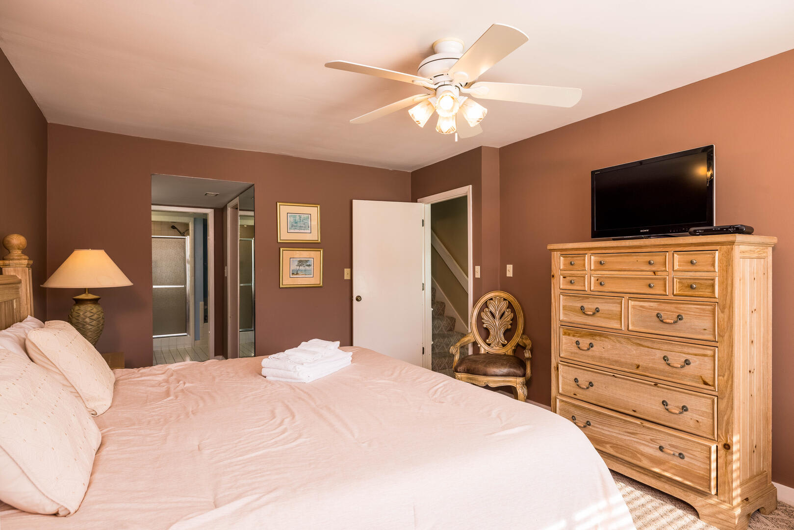 First floor primary bedroom with en suite bathroom