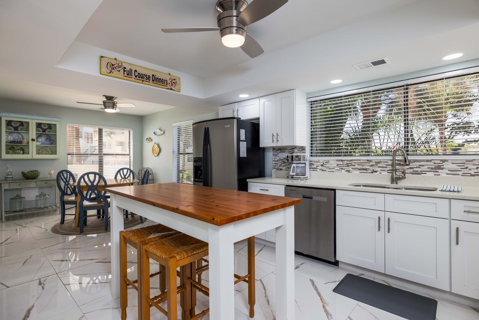 Large kitchen with island and eat in area.