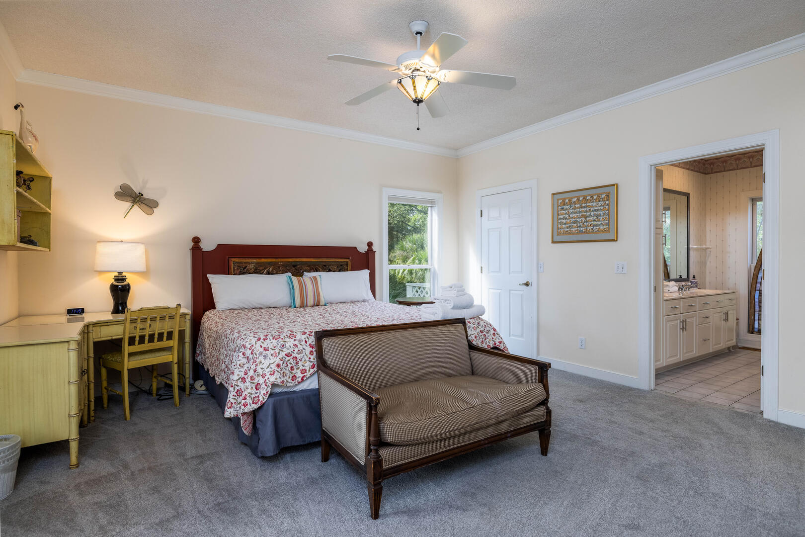First floor primary bedroom with en suite bathroom