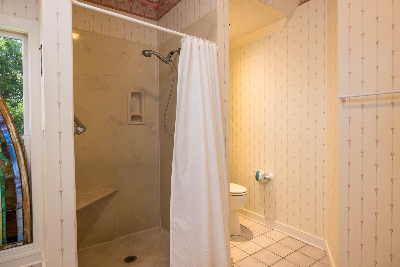 First floor primary bedroom with en suite bathroom