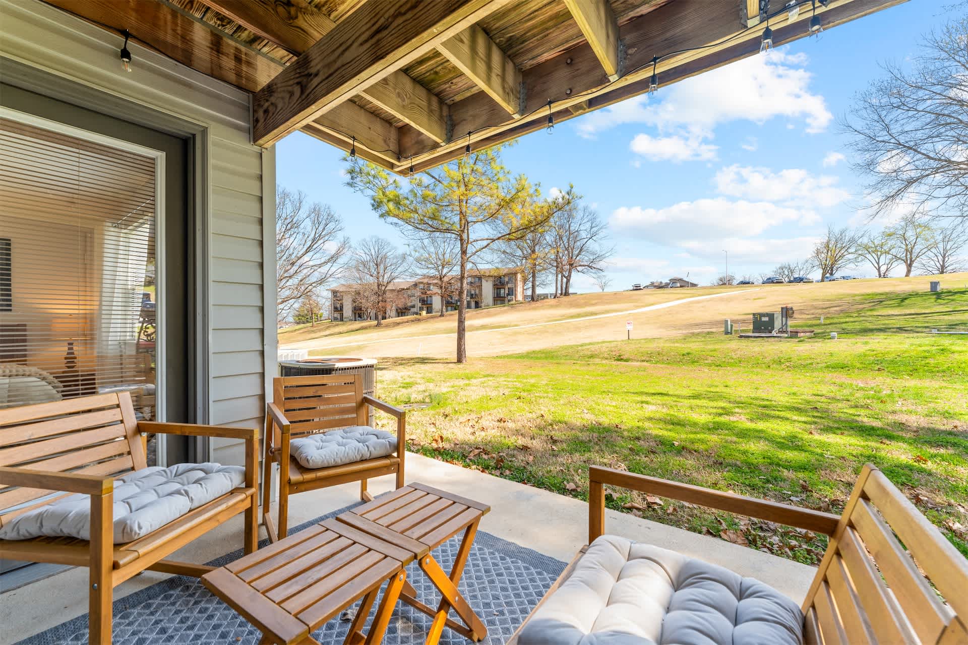 Relax on the private patio with comfortable seating and peaceful views of the golf course—perfect for morning coffee or unwinding in the evening