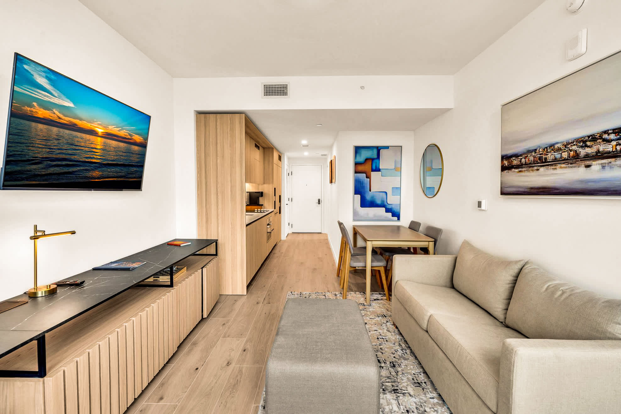 Stylish and cozy living area with modern amenities and chic decor, perfect for relaxation and dining.