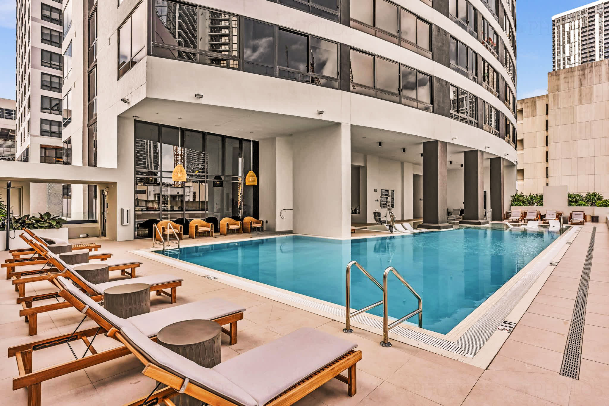 Enjoy a refreshing swim in this sleek, modern pool surrounded by the cityscape.