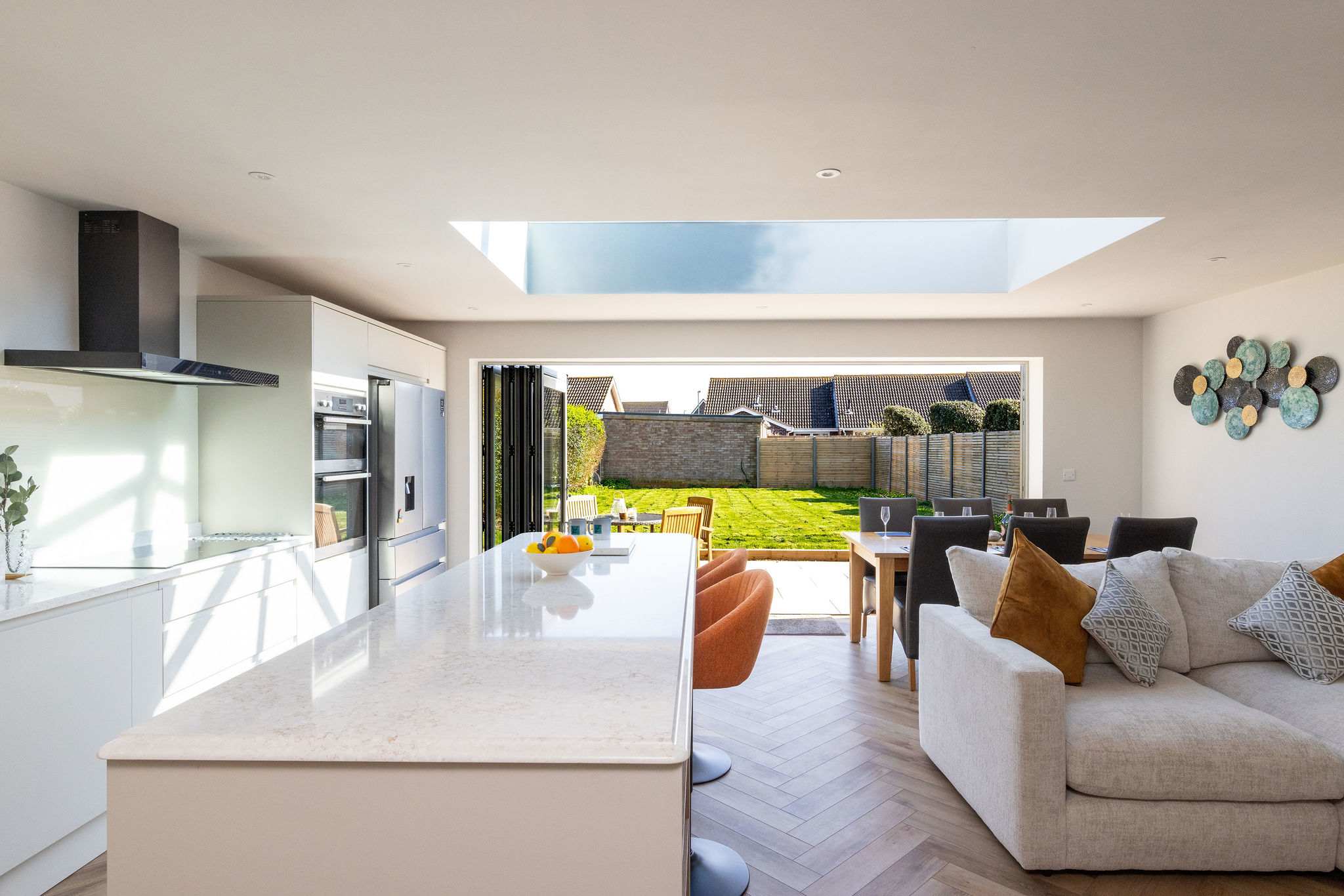 Light-filled open-plan space designed for comfort, ideal for relaxing and socialising during your coastal stay.