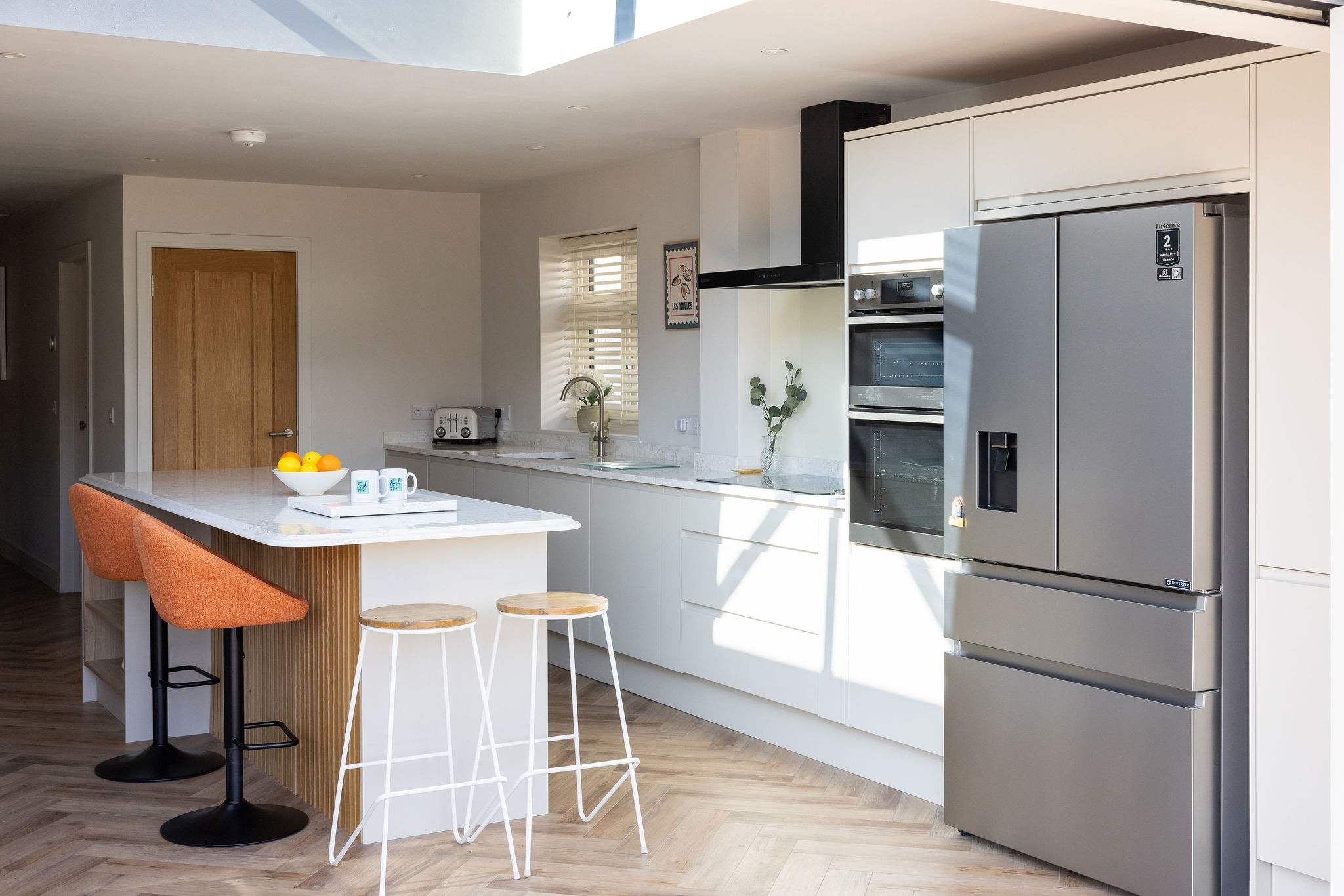 Contemporary coastal home with a fully equipped kitchen and spacious layout for relaxed family living.