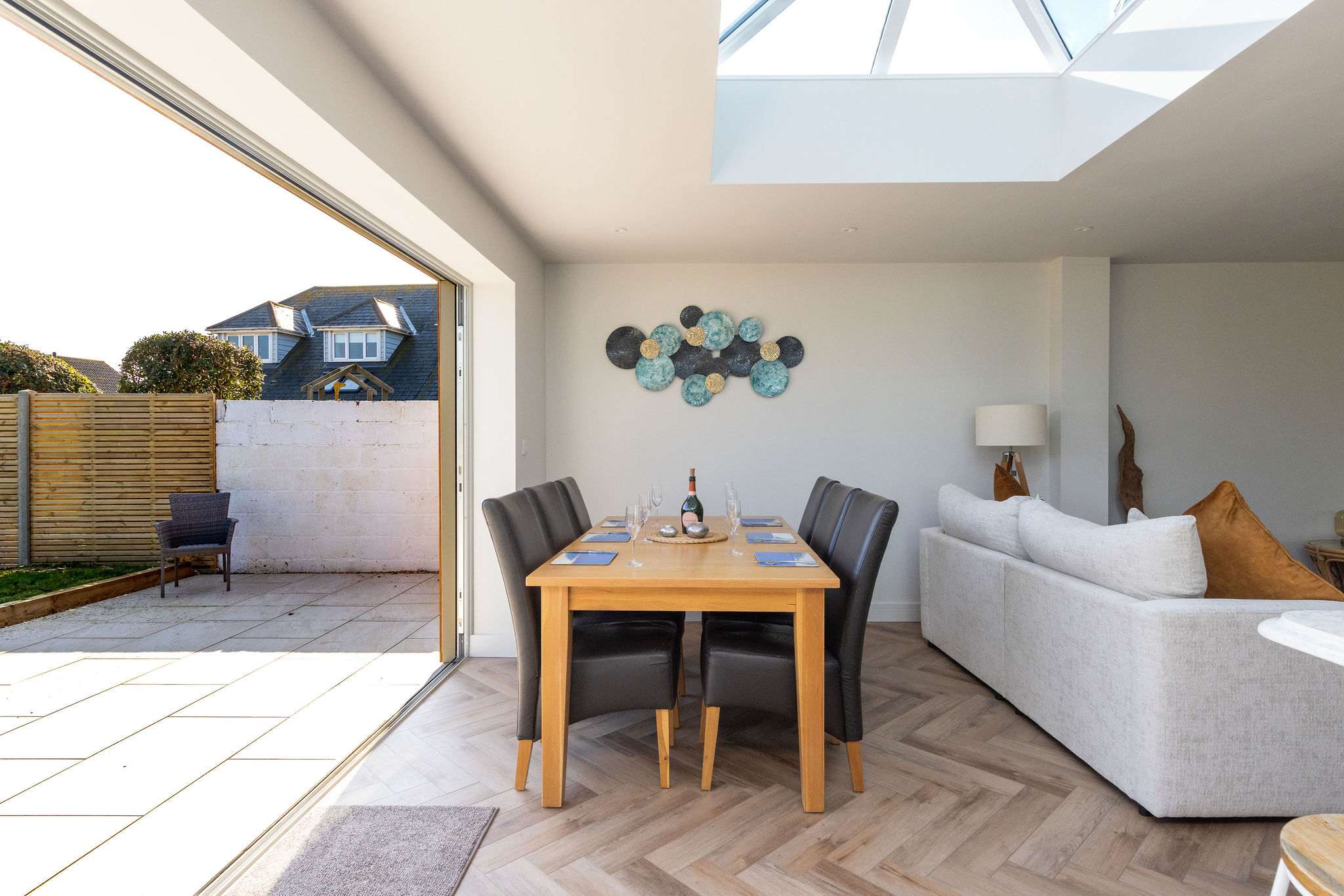 Stylish open-plan living with easy garden access, ideal for indoor-outdoor coastal living.