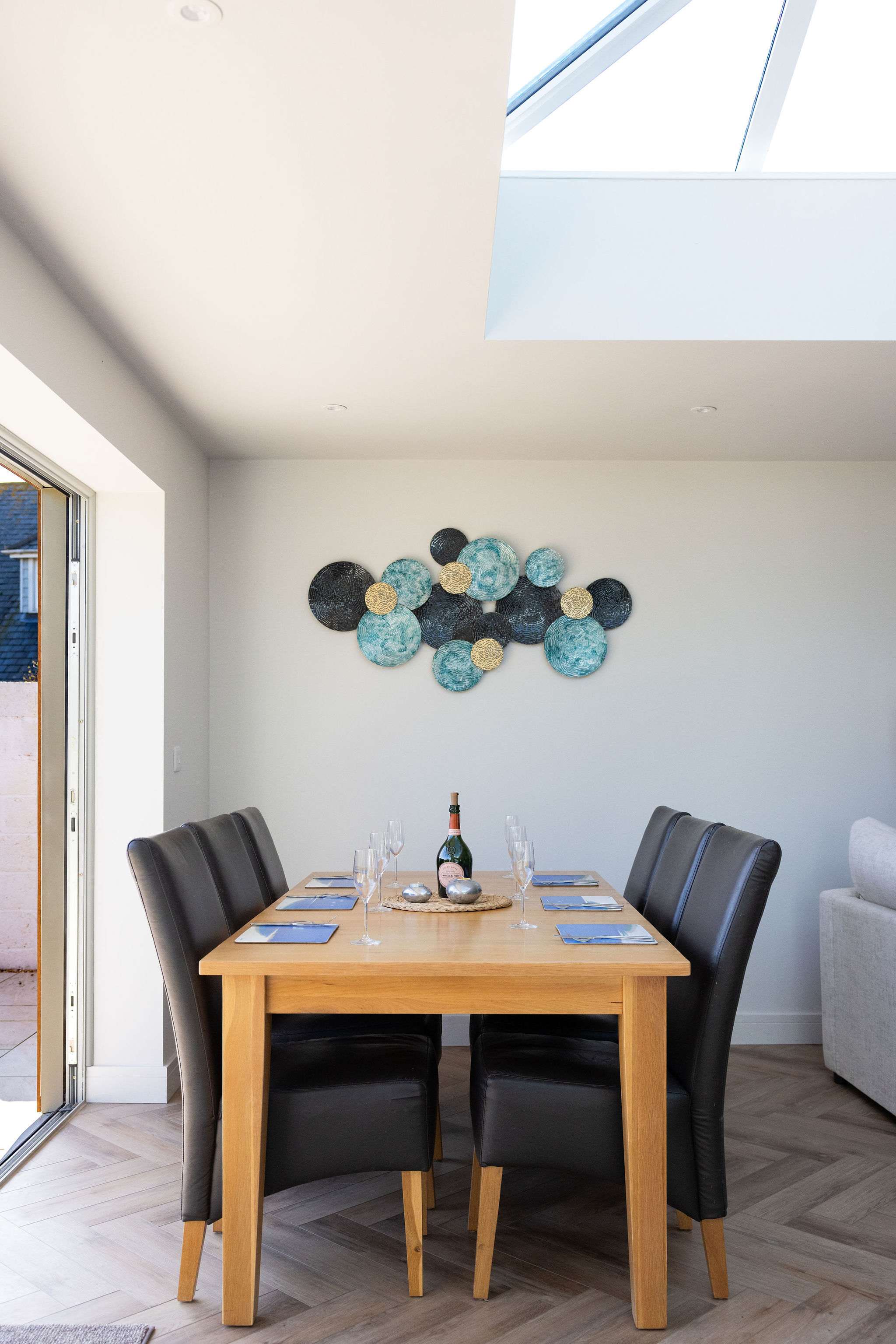 Stylish coastal retreat with a welcoming dining space, perfect for relaxed meals during your seaside stay.