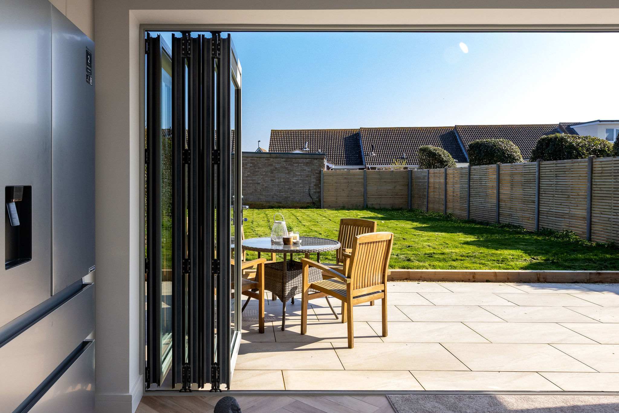 Modern coastal home with private garden, perfect for relaxing and enjoying outdoor living by the sea.