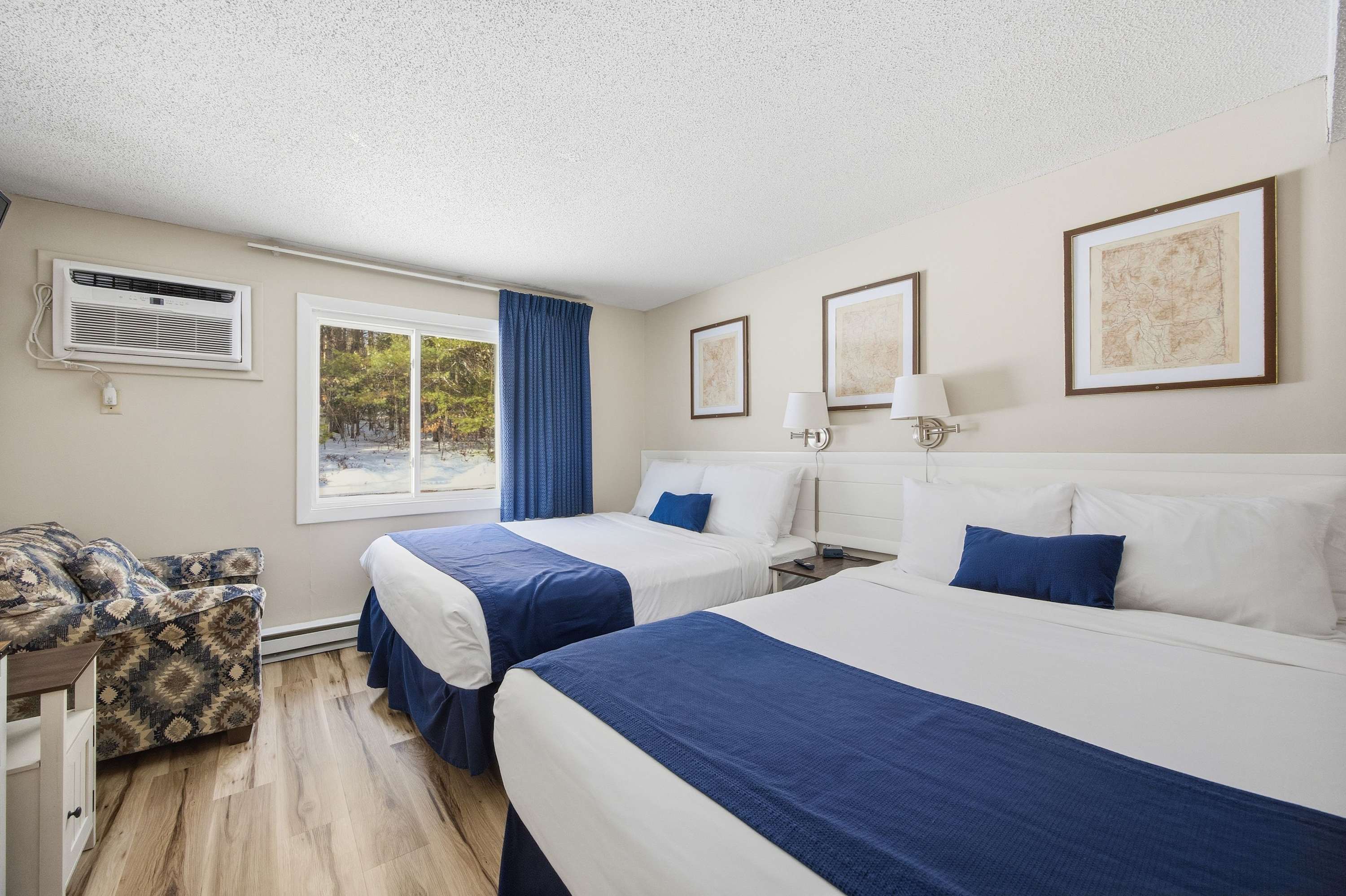 A pair of plush queen beds & a TV await in the bedroom​