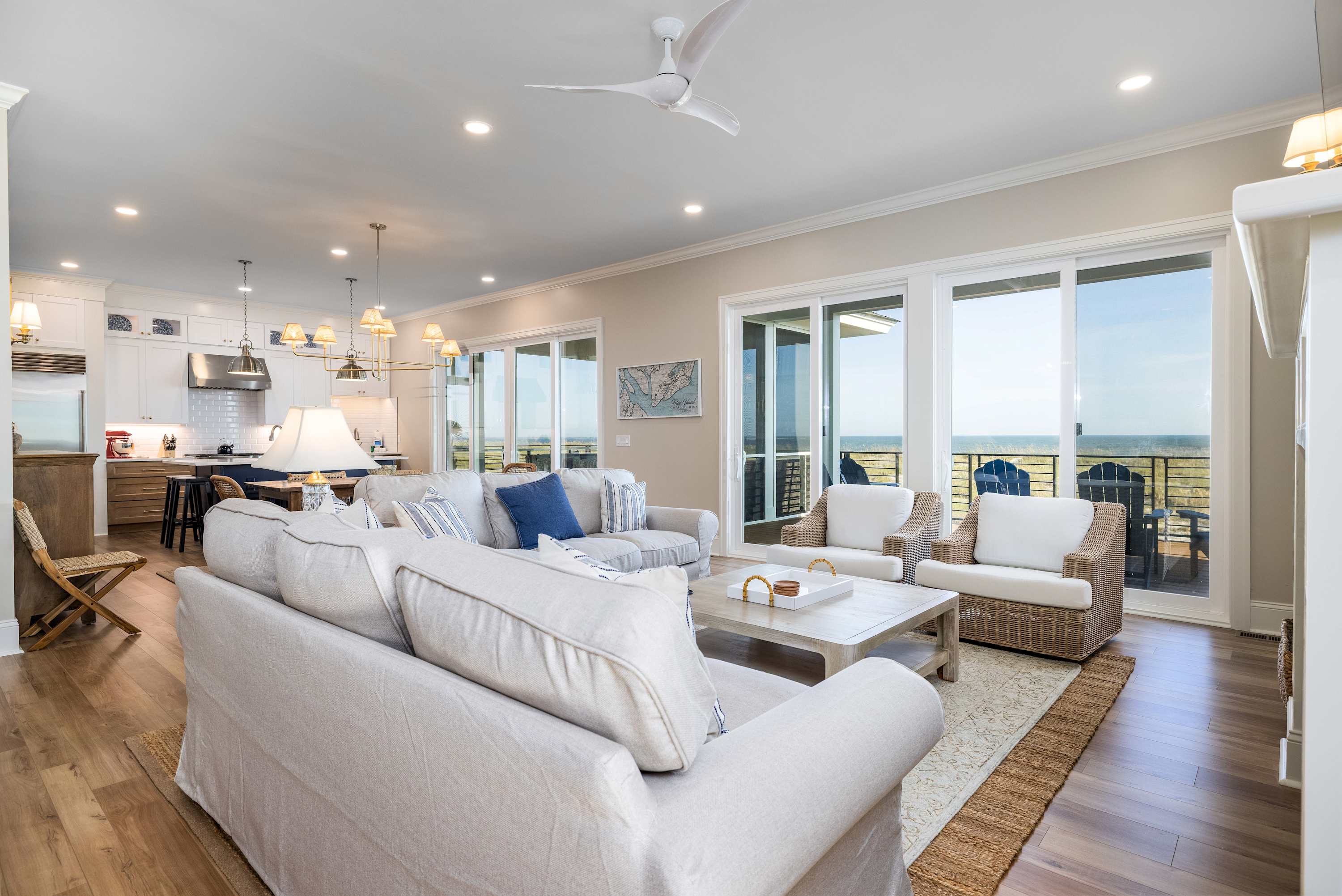 Open Concept Living, Dining and Kitchen Areas with Access to Decks