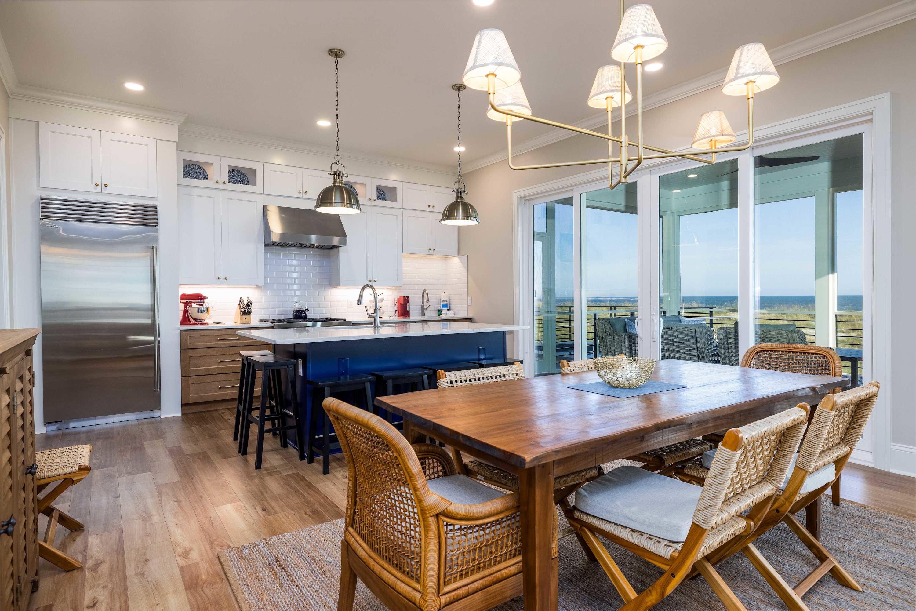 Dining Area, Island Bar and Chef's Kitchen with Access to Screened Porch