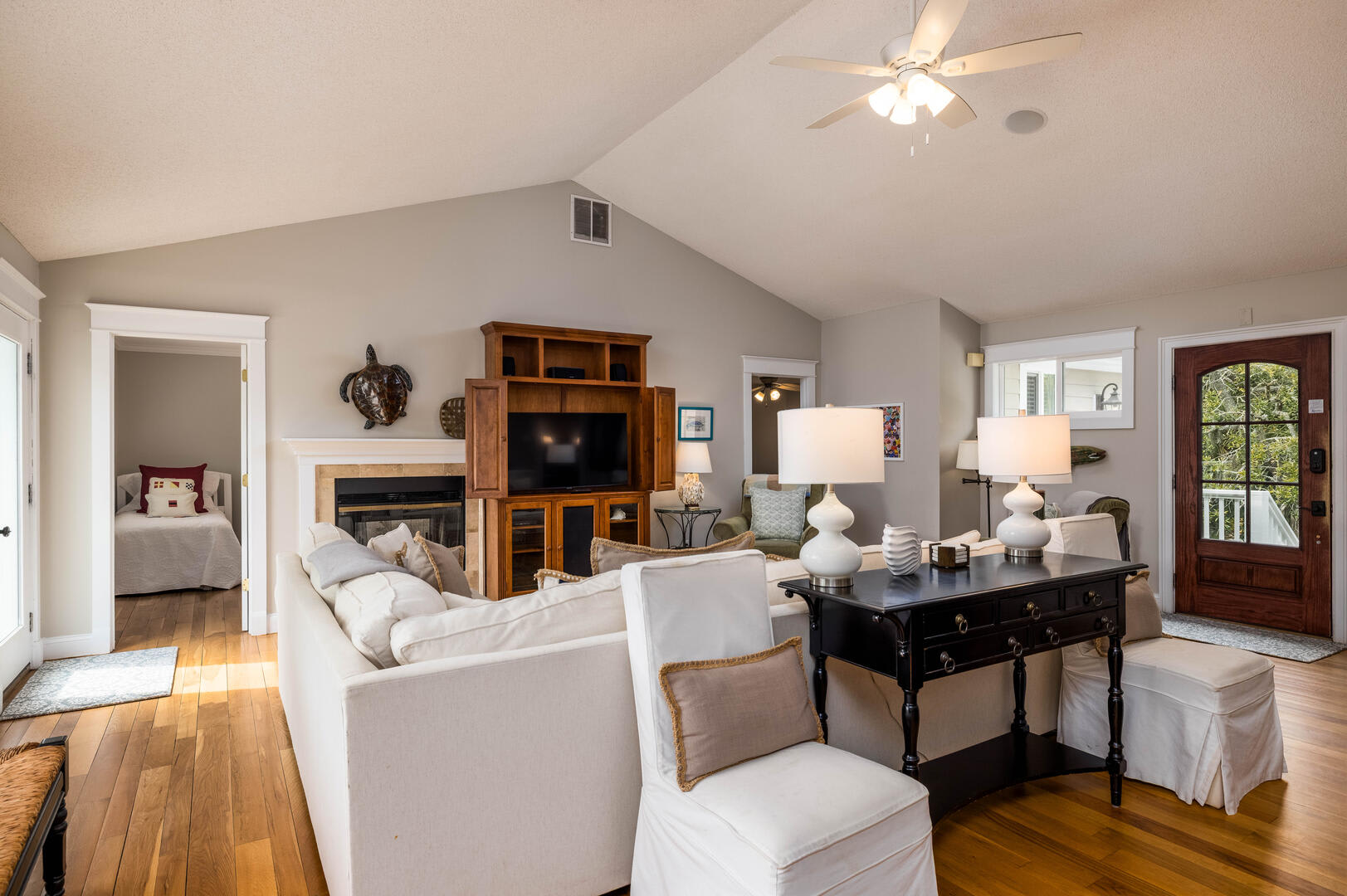 Open Concept Living Room with Dining Area and Access to the Deck
