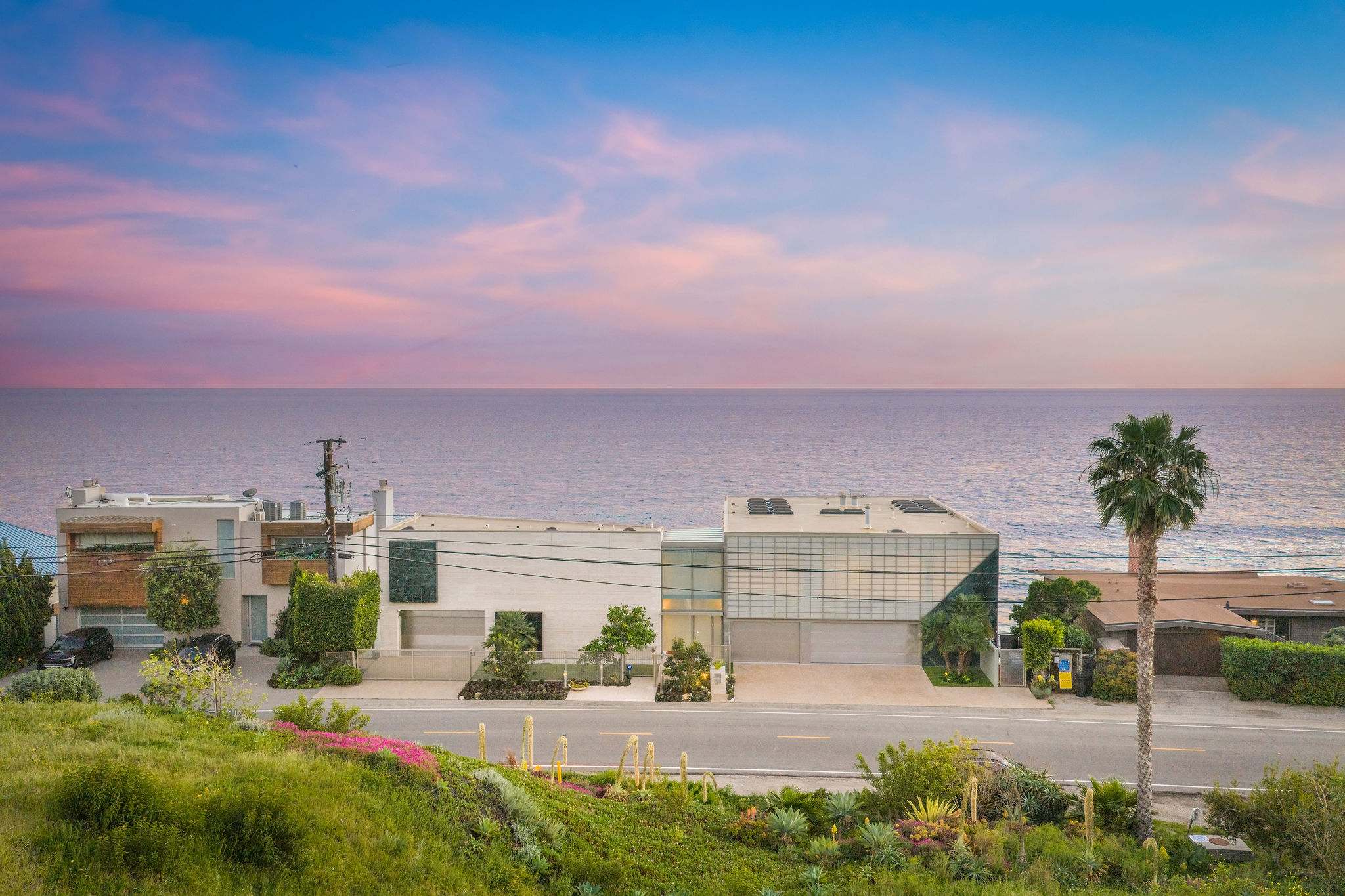 Elevated view of the Malibu Yacht Club estate overlooking the Pacific coastline.