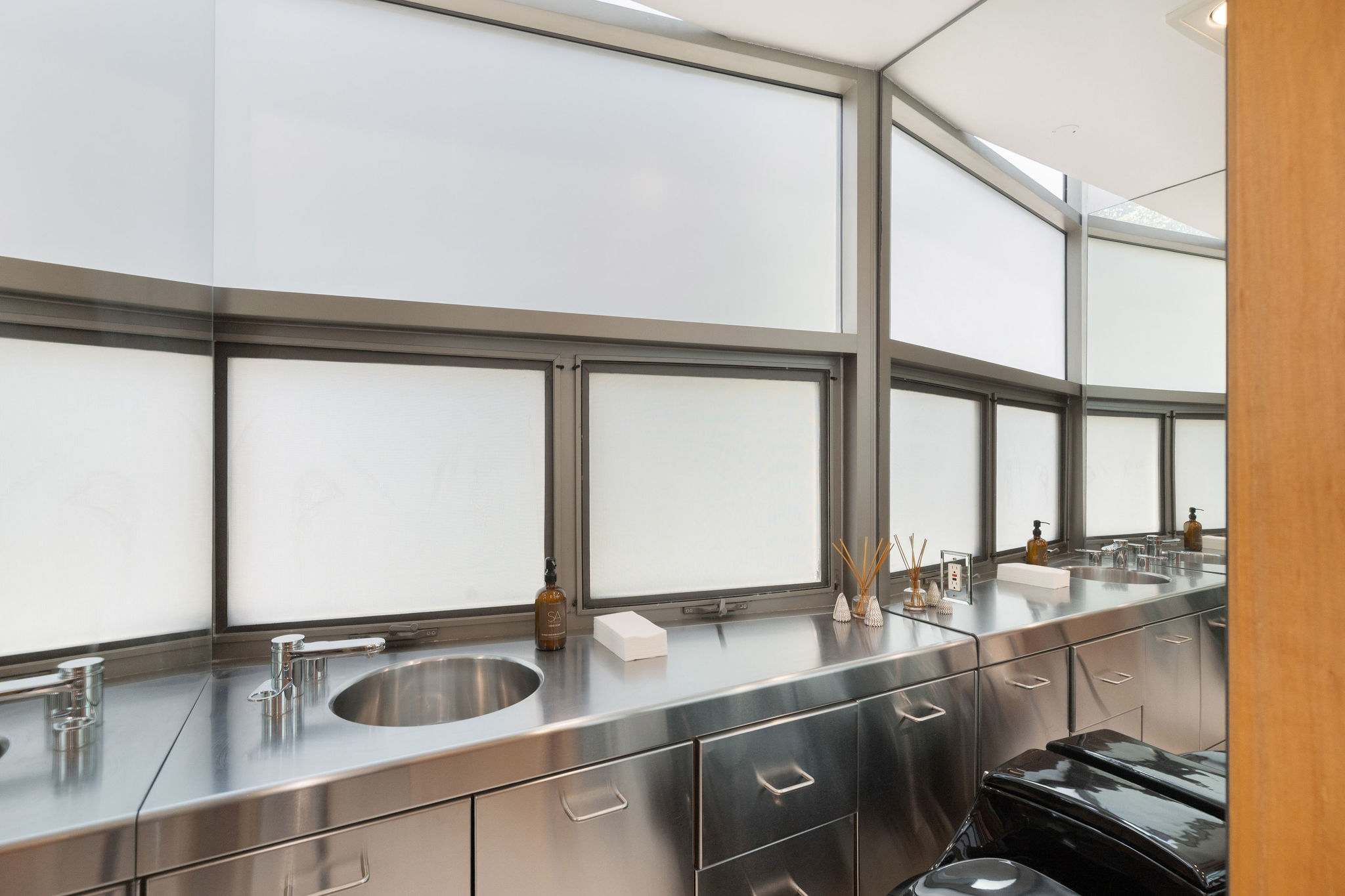 Private styling and prep station with stainless steel cabinetry in this Malibu oceanfront estate.