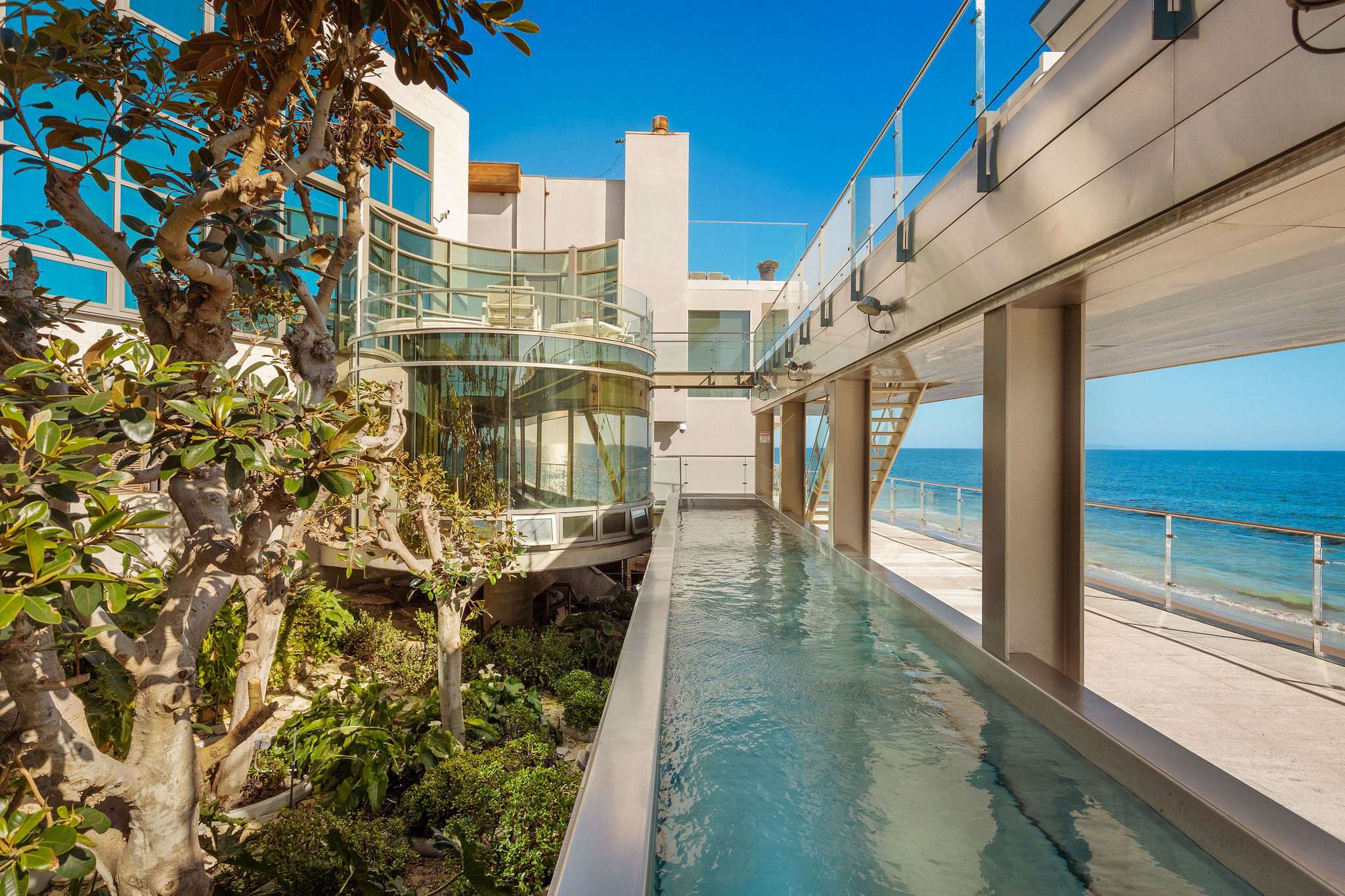 Architectural courtyard with reflecting water feature in a Malibu luxury estate.