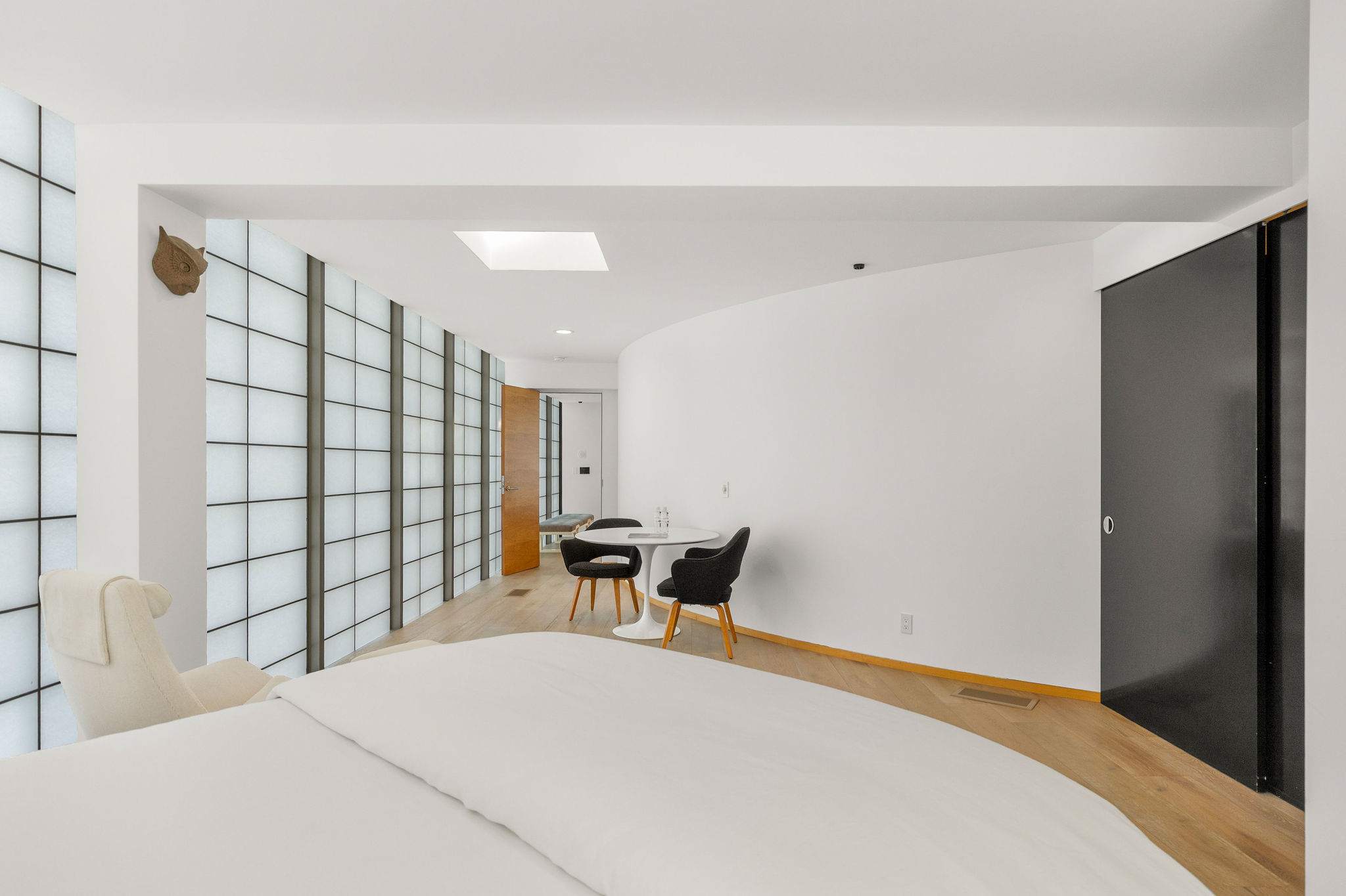 Minimalist bedroom retreat inside a Malibu beachfront residence.