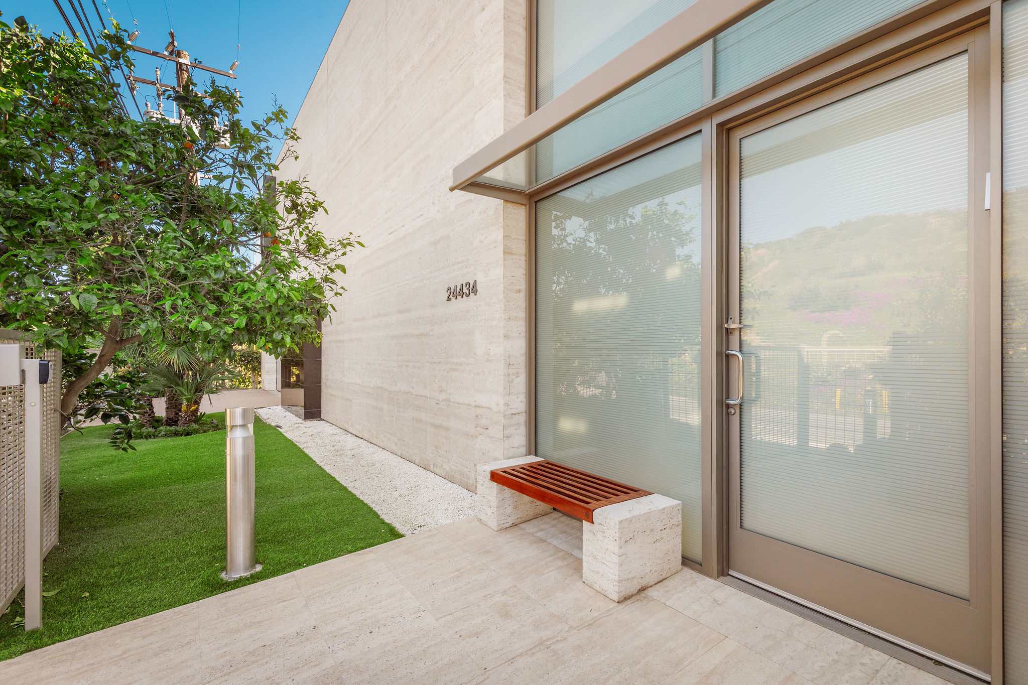 Exterior garden walkway beside the Malibu beachfront home.