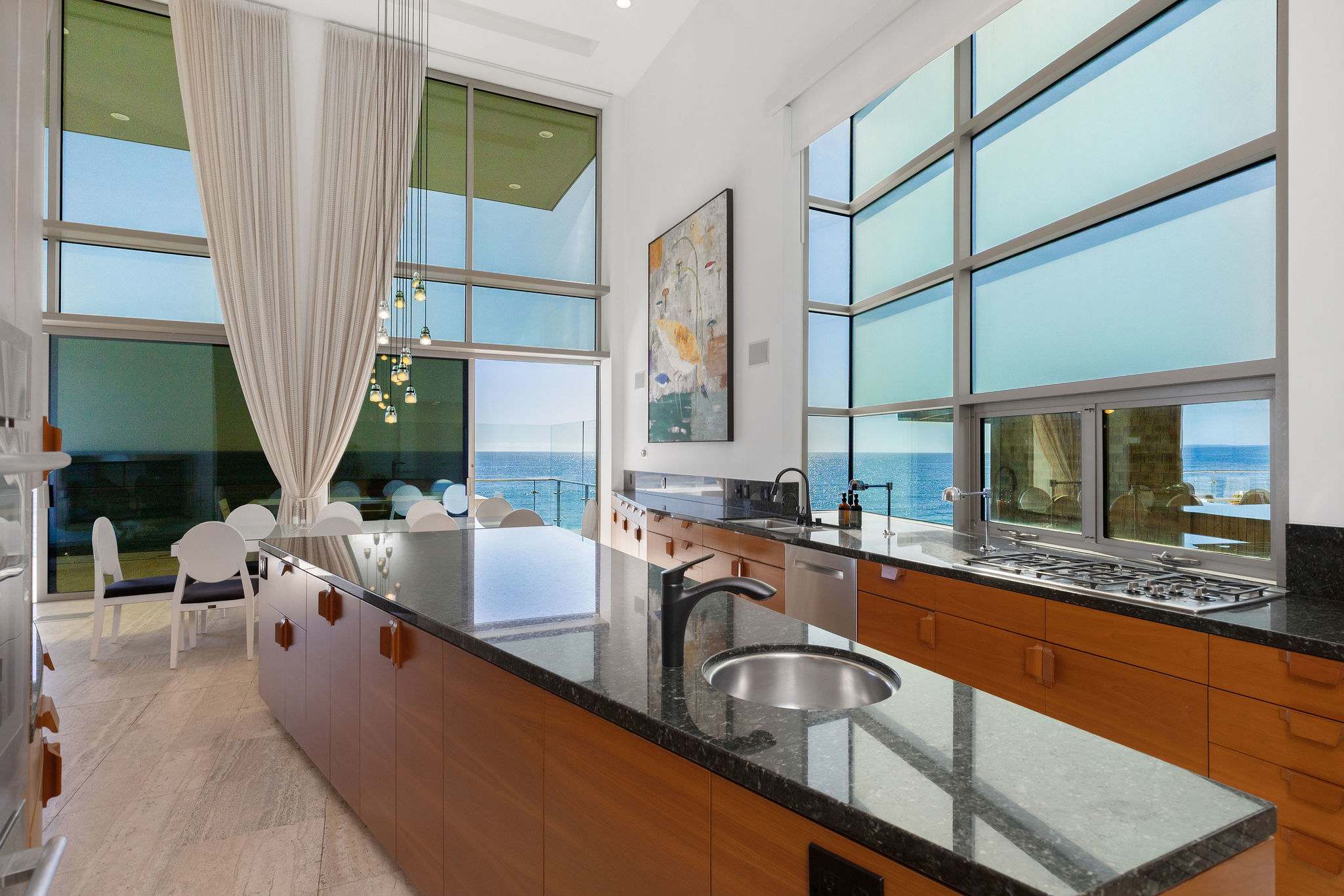 Contemporary kitchen with clean lines inside a Malibu beachfront estate.