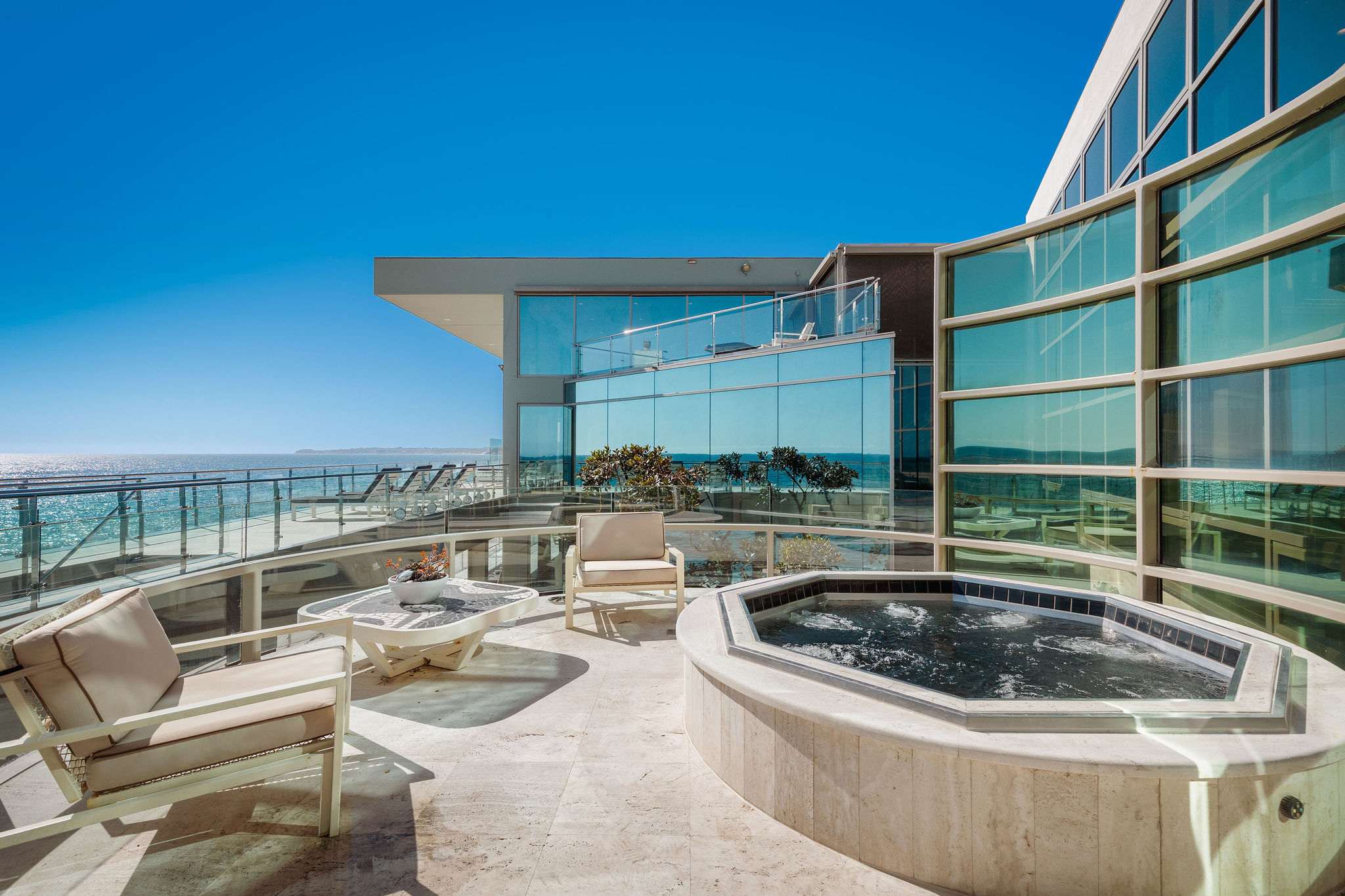 Private Malibu deck with spa and sweeping Pacific Ocean views.