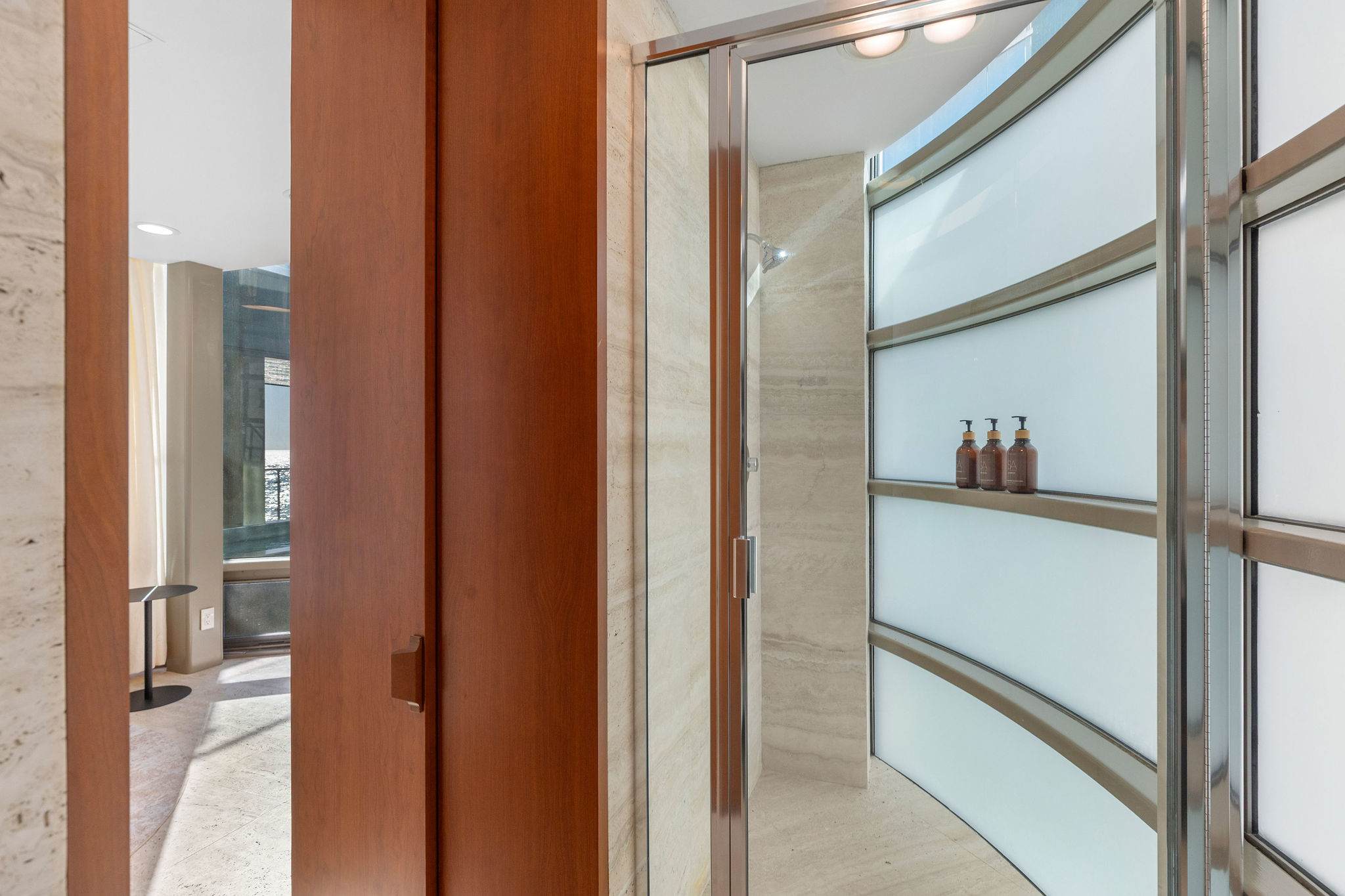 Curved architectural glass wall detail in this Malibu luxury home.
