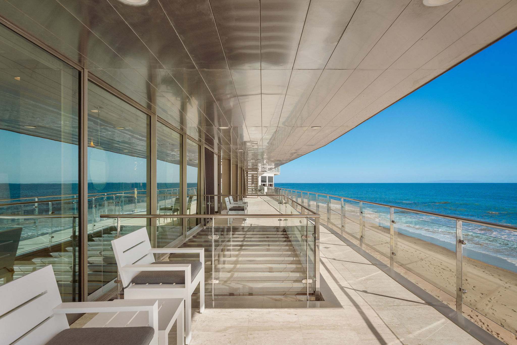 Oceanfront Malibu terrace stretching along the Pacific shoreline.