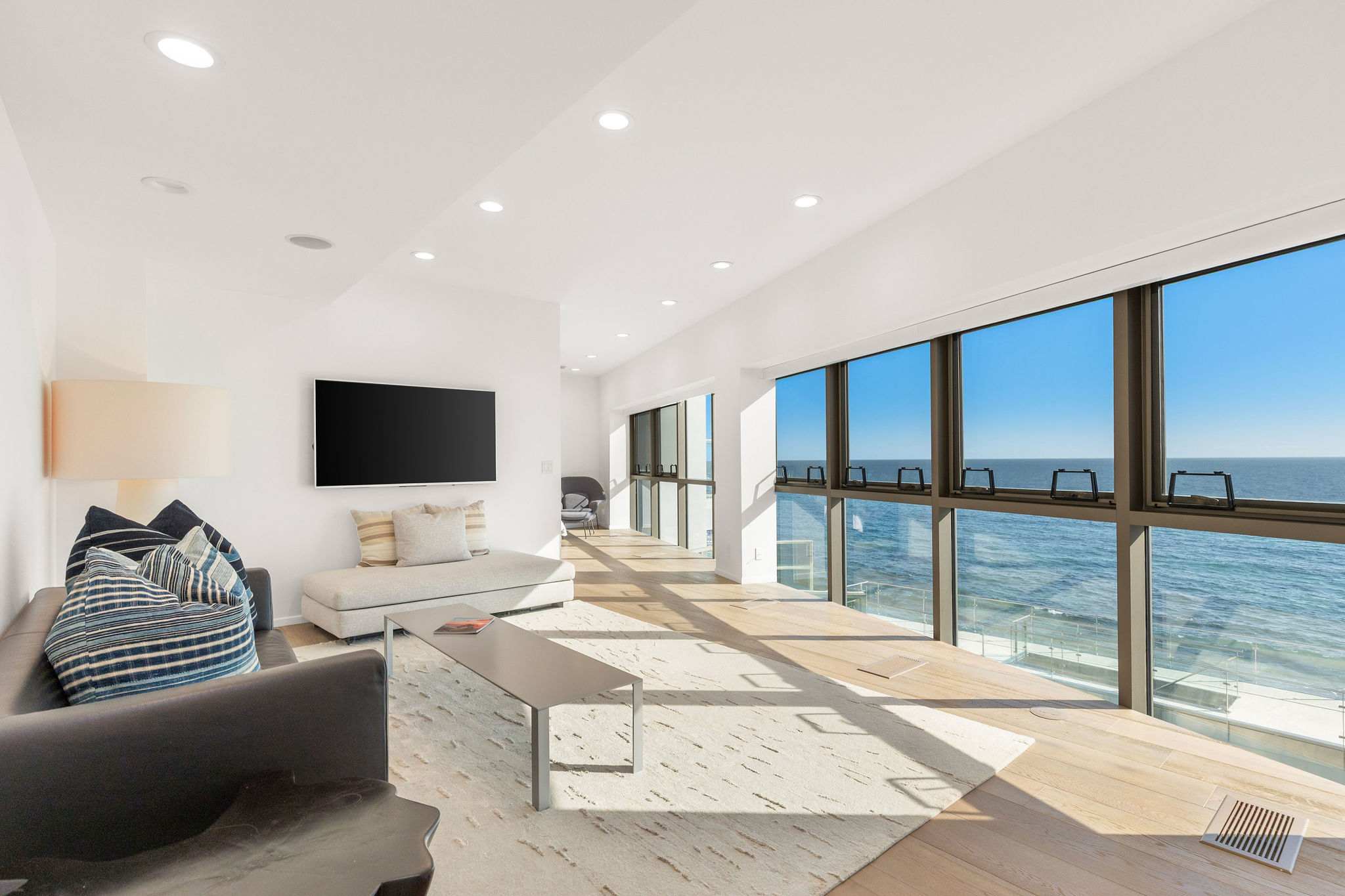Oceanfront living room capturing Malibu’s Pacific horizon.