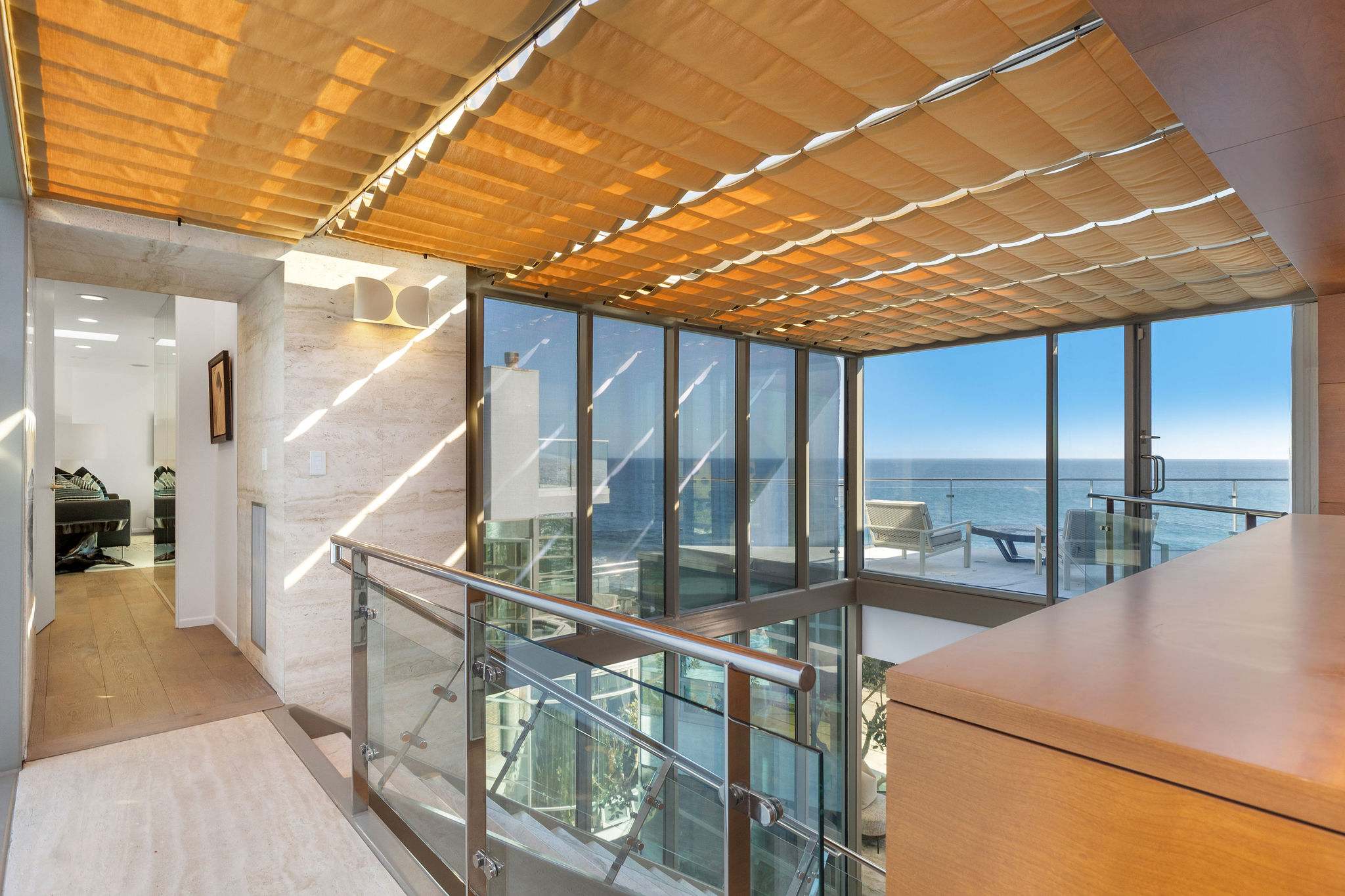 Architectural mezzanine with sweeping Malibu coastline views.