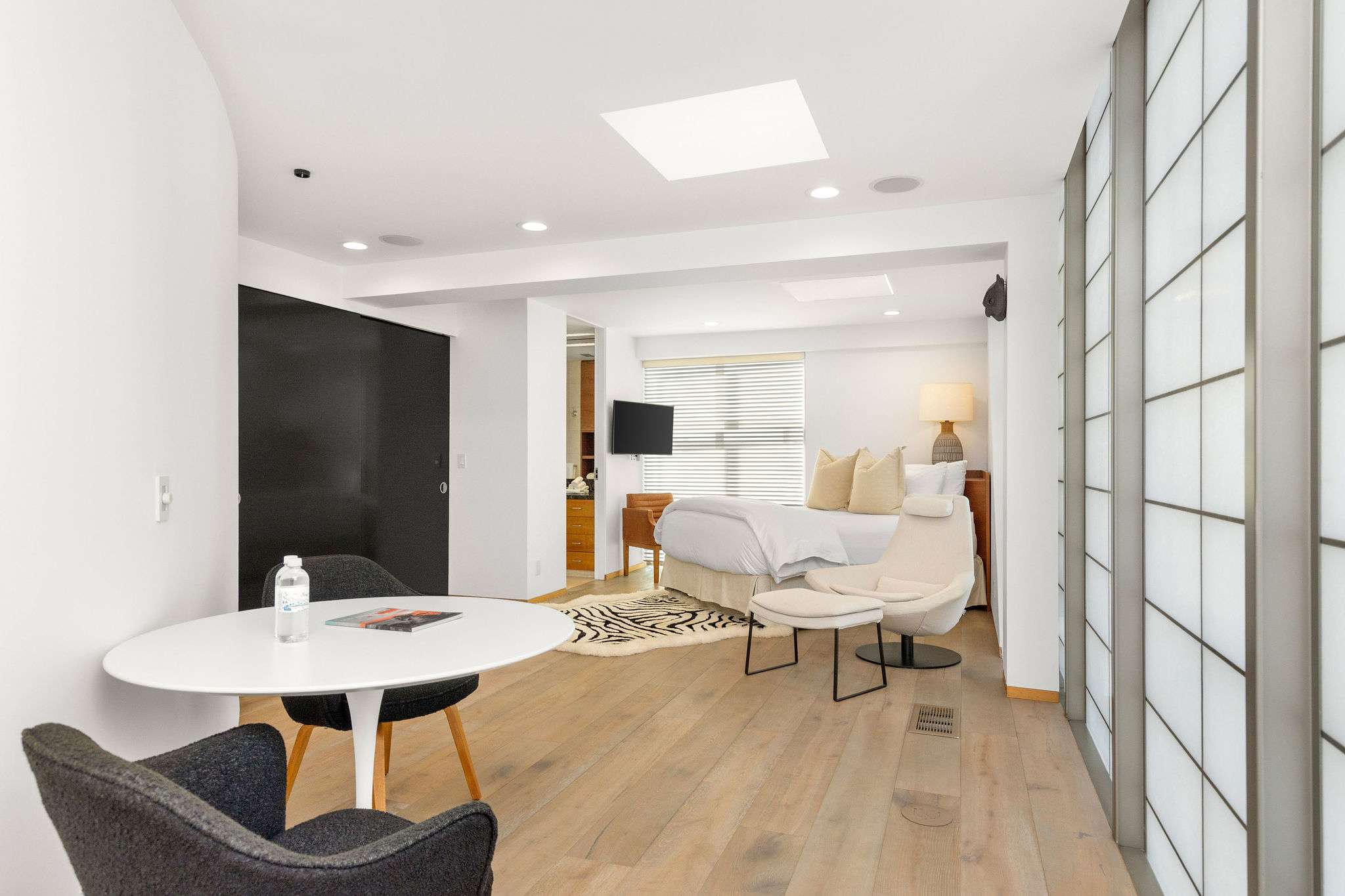 Guest bedroom within a contemporary Malibu beachfront estate.