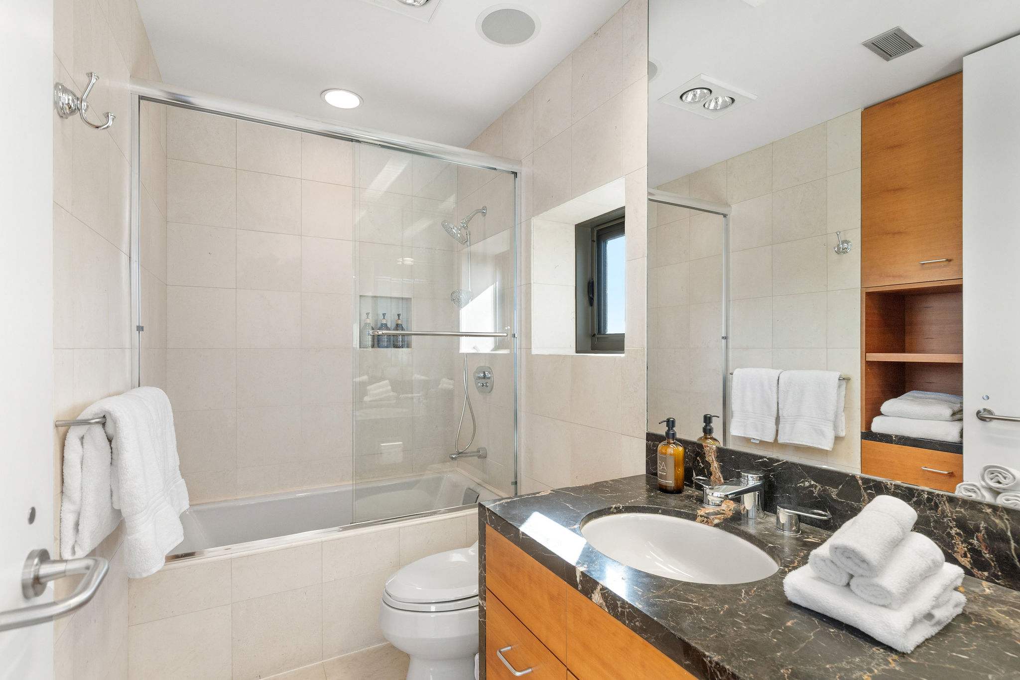 Contemporary Malibu bathroom with glass shower and soaking tub.