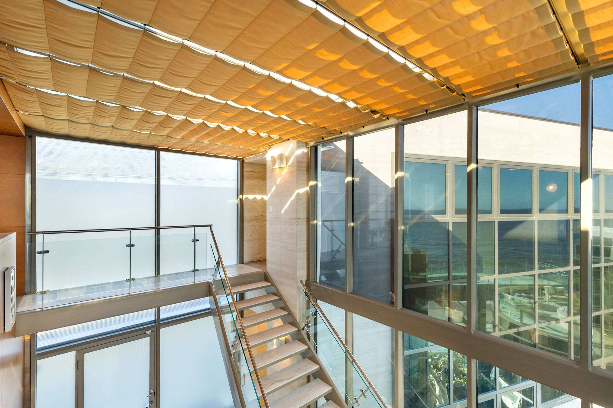 Upper-level terrace overlooking Malibu’s Pacific coastline.