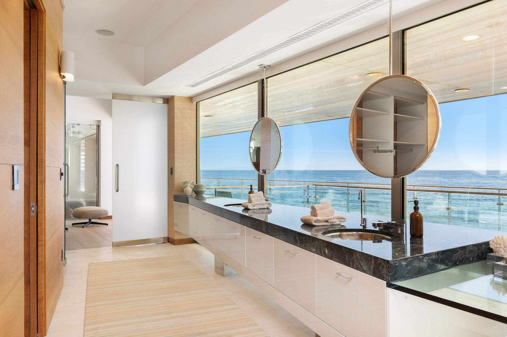 Designer Malibu bathroom with panoramic glass and modern finishes.