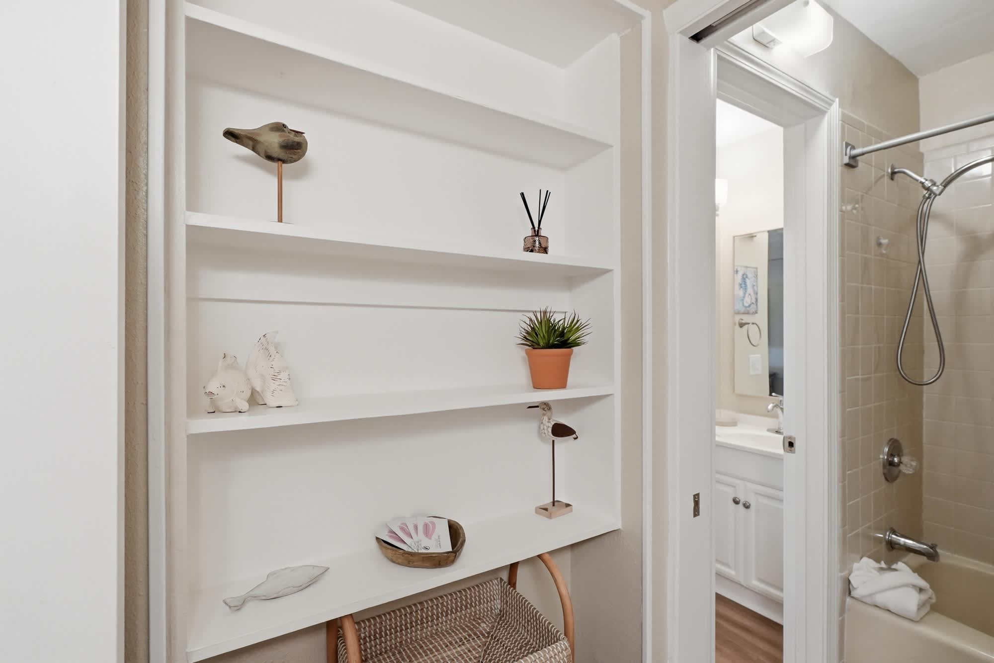 The Summit 419 – Shelf with decorative items and a doorway leading to a bathroom in a vacation rental.
