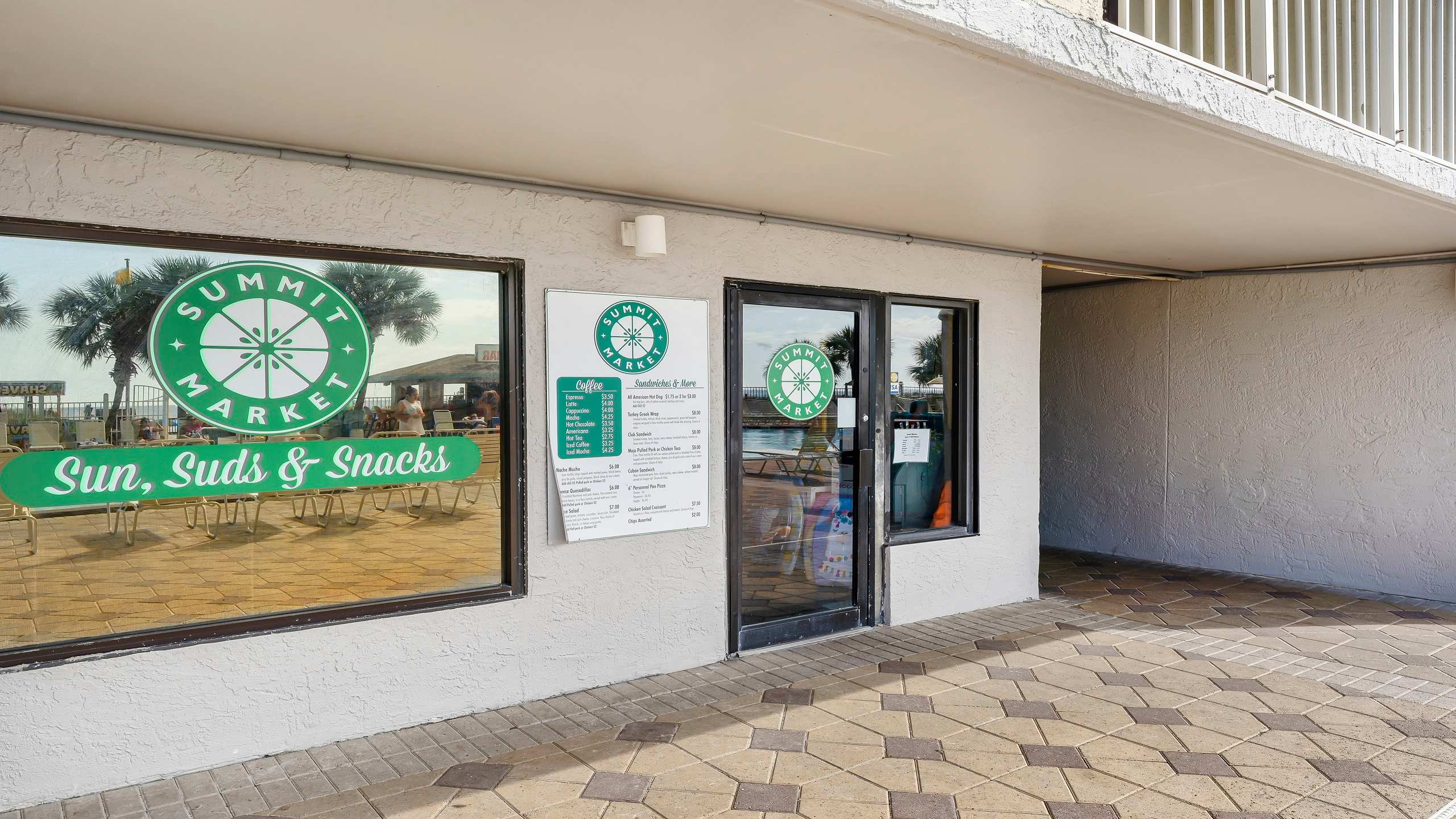 The Summit 419 – Exterior view of Summit Market with signage and outdoor seating area.