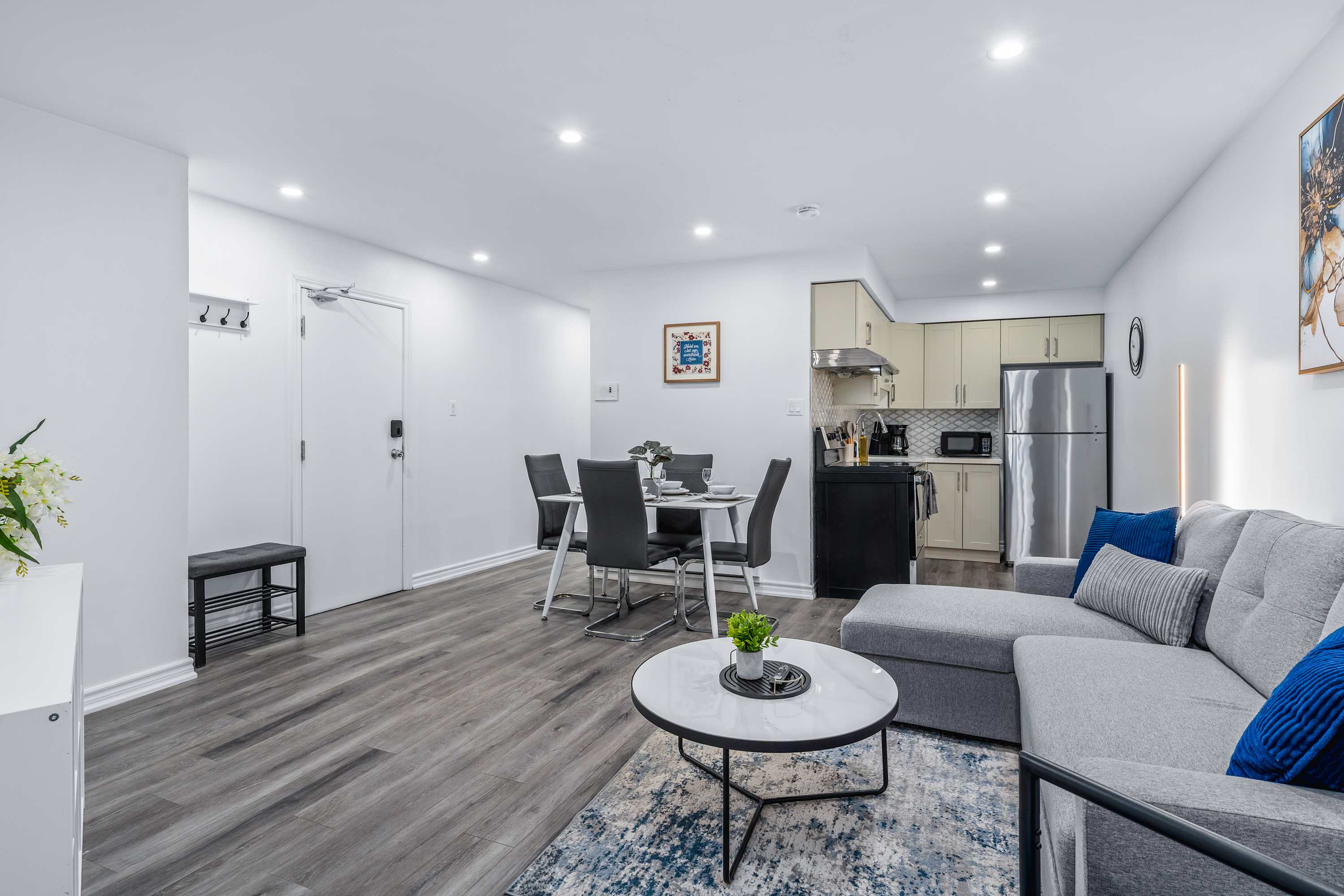 Open-concept space connecting living, dining and kitchen.