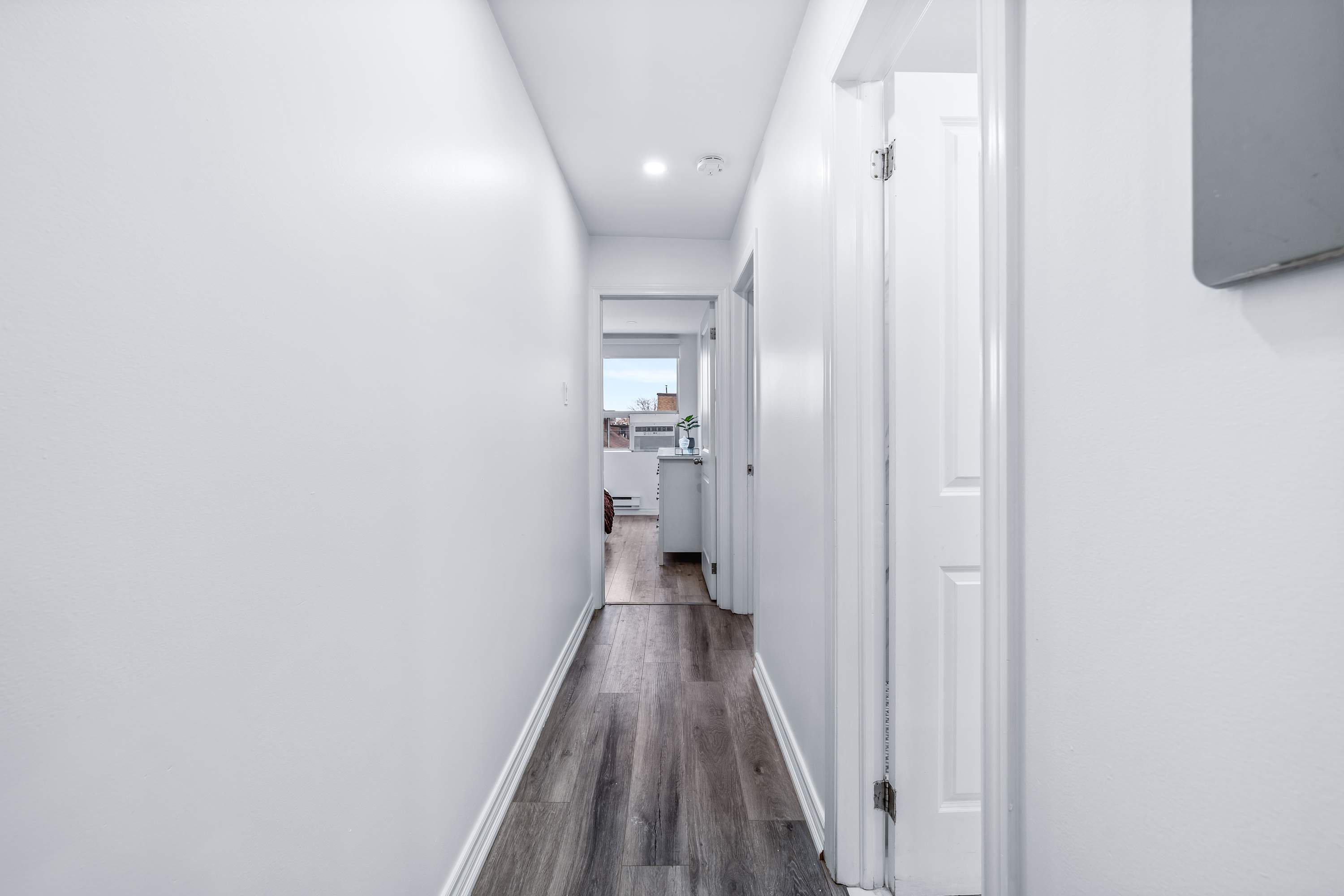 Bright hallway leading to bedrooms.