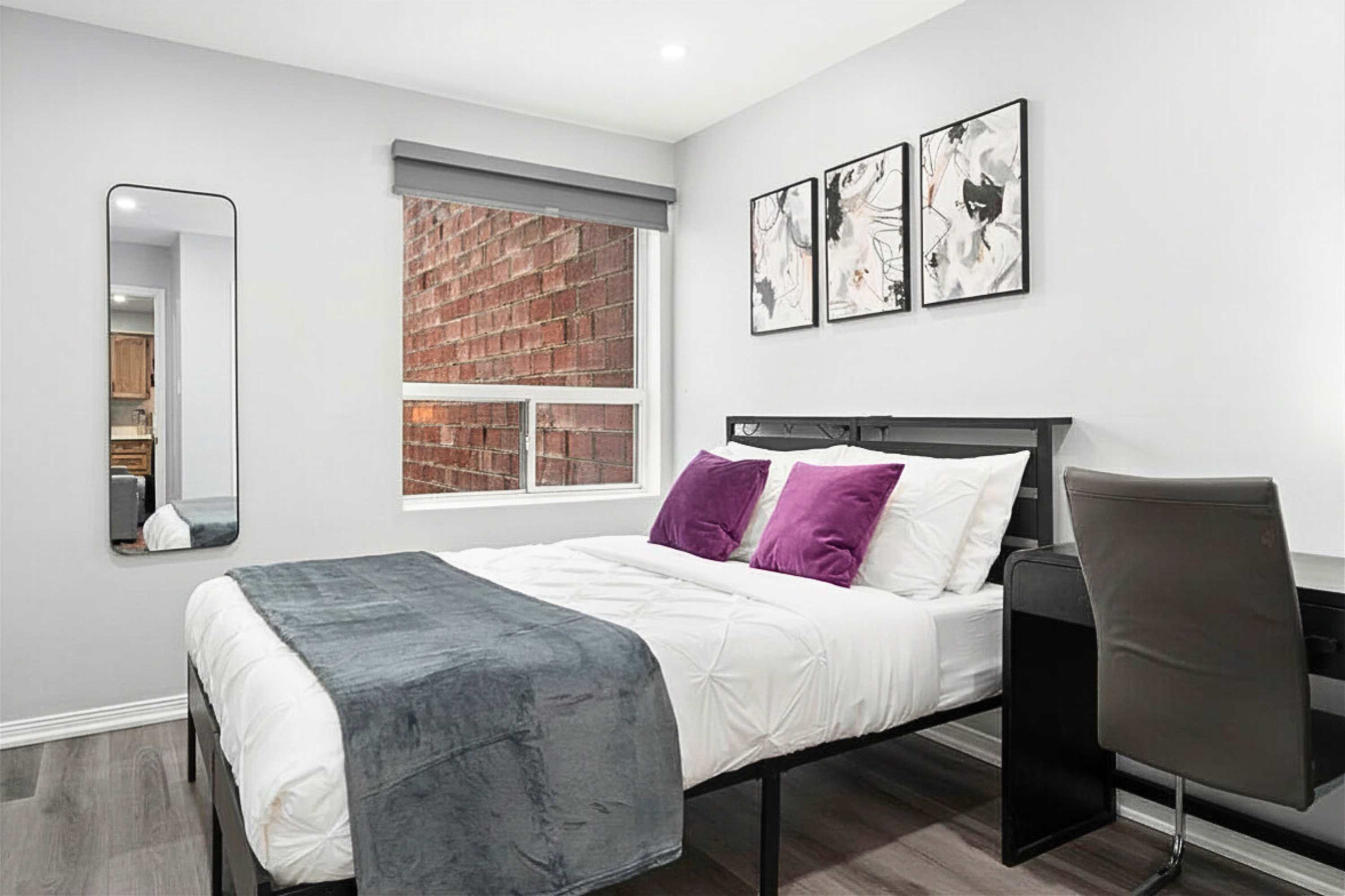 Rest and productivity in one space. A queen bed and a dedicated desk for your remote work setup.