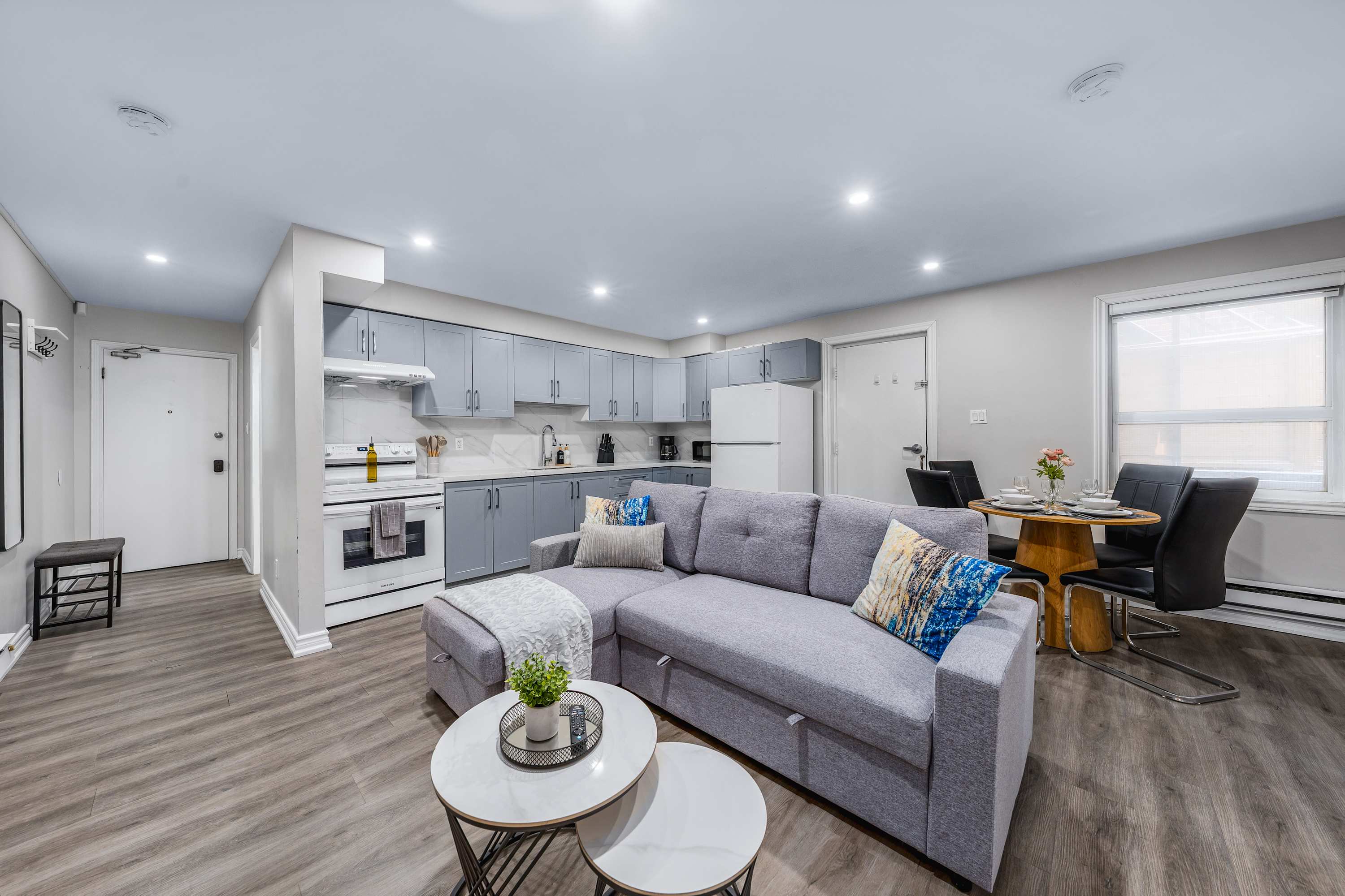 Bright open living space with kitchen and dining.