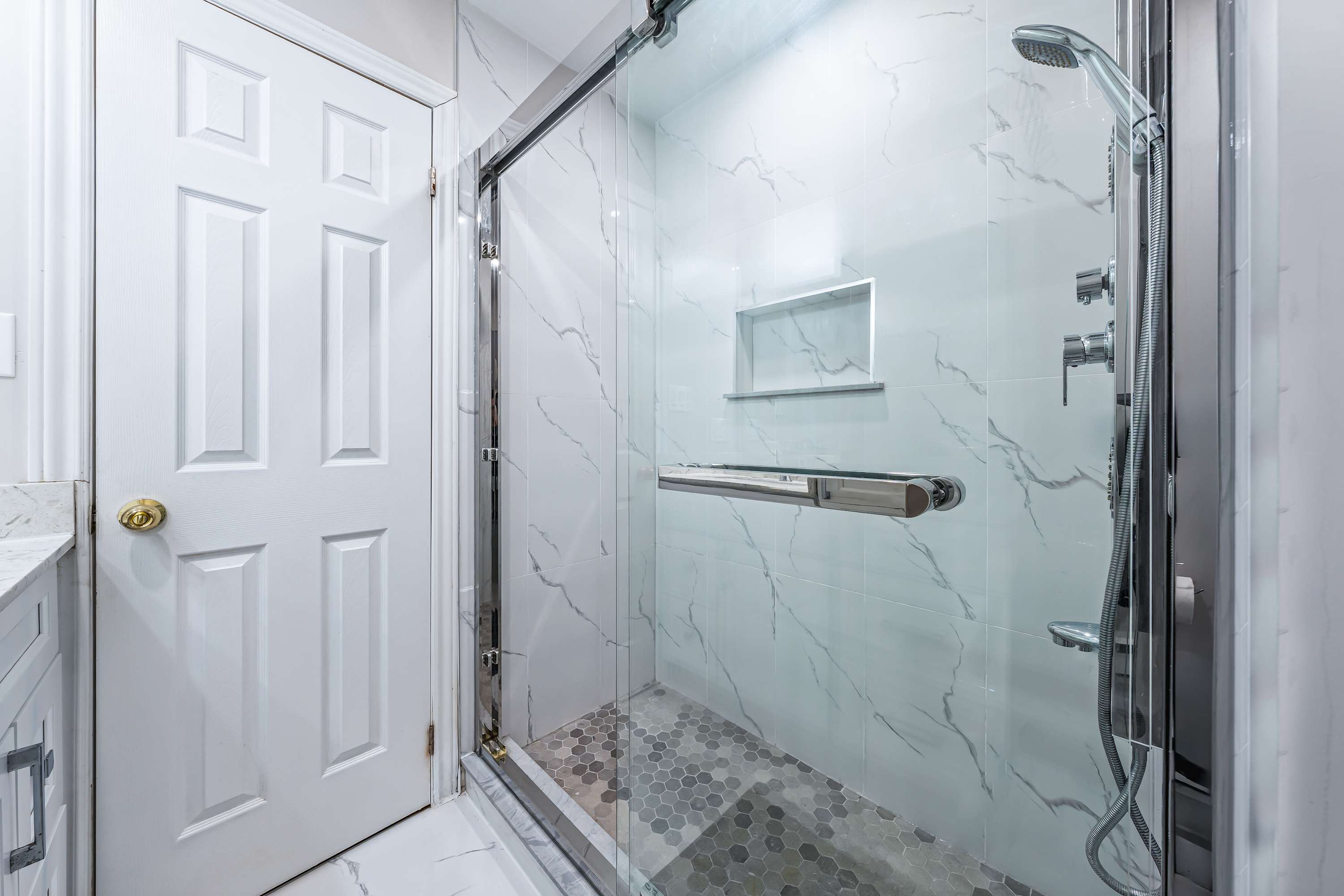 Spacious shower with modern finishes.