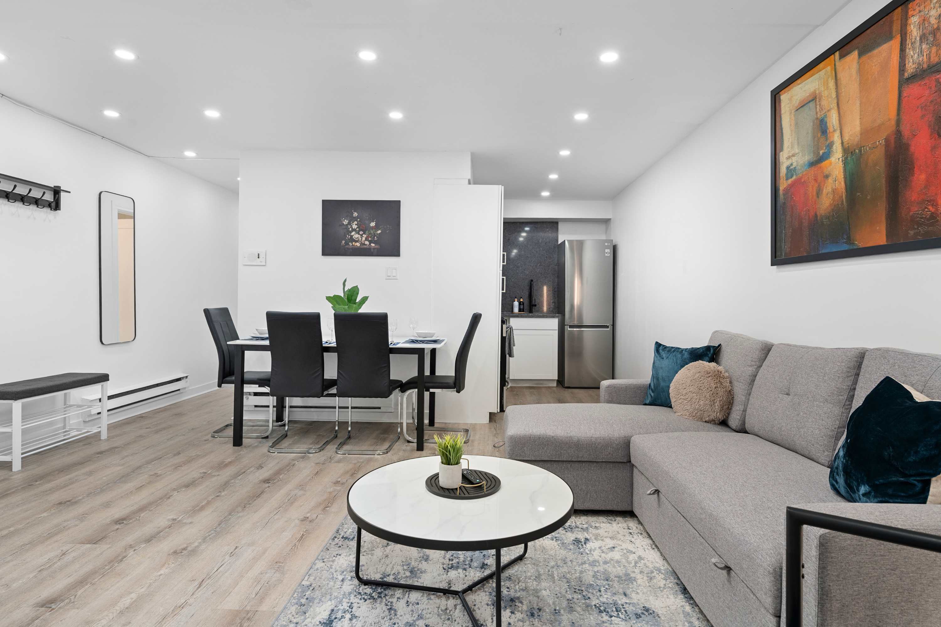 Dining area with a modern table, seamlessly connected to the kitchen.
