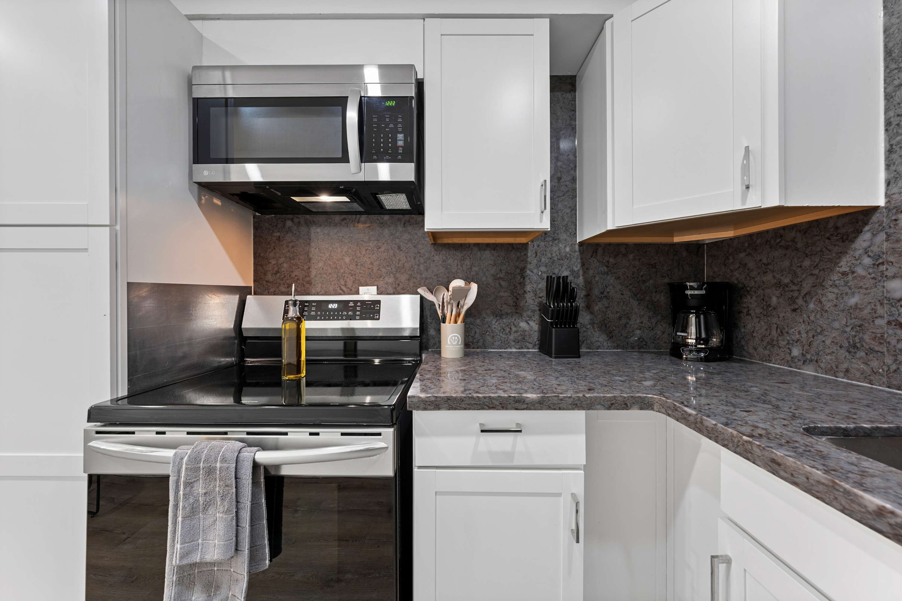 Cozy kitchen with a dedicated cooking area and all essentials for meal prep.