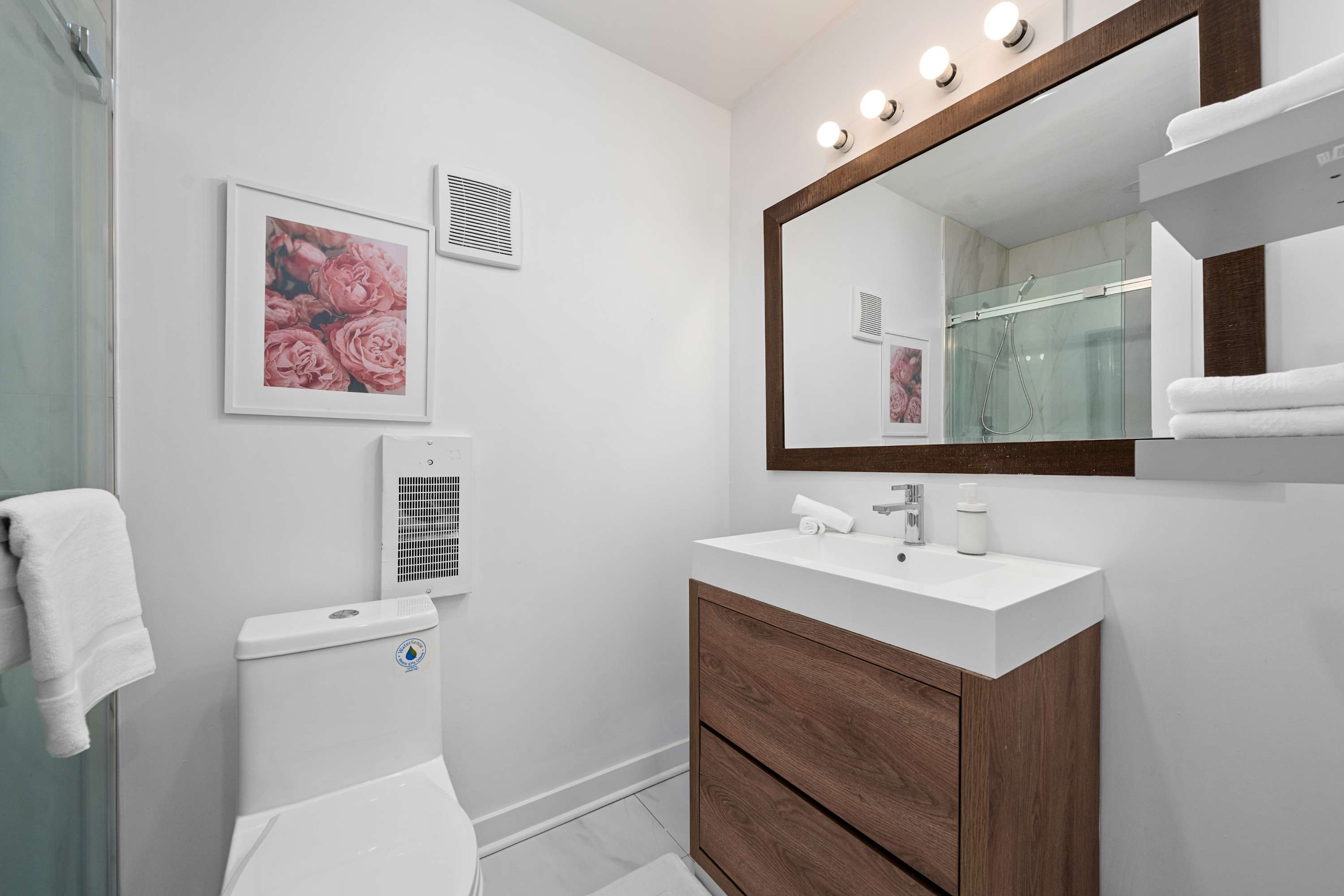 Vanity bathroom with illuminated mirror, perfect for your morning routine