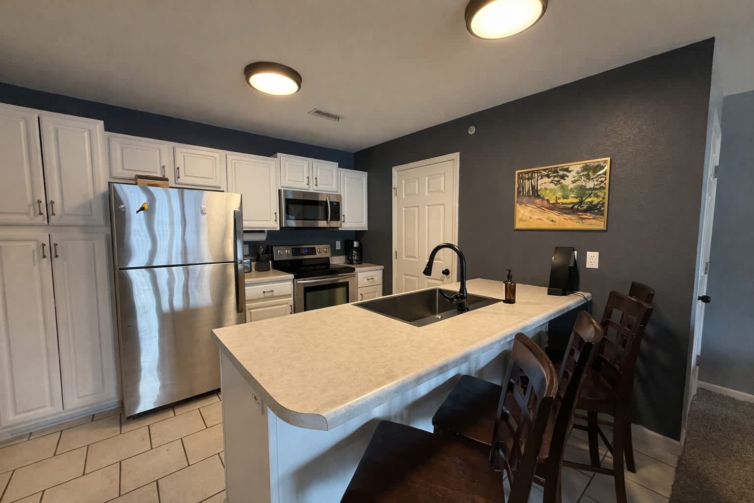The open kitchen offers ample space & all the comforts of home​